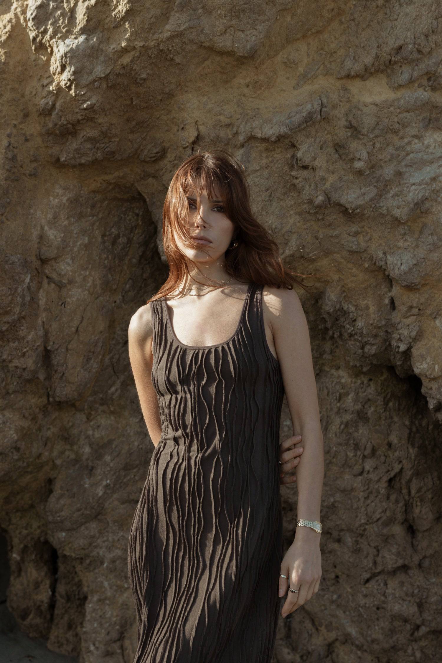 8861267755229, The Aliya Dress, Dress, All Row, Black,bodycon,brown,Casual,cf-color-black,cf-color-ivory,cf-size-l,cf-size-m,cf-size-s,cinched,ivory,Midi,new,nylon,racerback,rust,Sleeveless,Sleeveless Dress,Slit,spring,straight-cut,summer,texture,textured,Textured Fabric,viscose,Women's, Information The Aliya Dress is a tank midi dress that is crafted from a textured, pintucked stretch fabric. It boasts a sheer bodice and a scoop neckline. A summer addition piece to dress up or wear casually. Details Self: