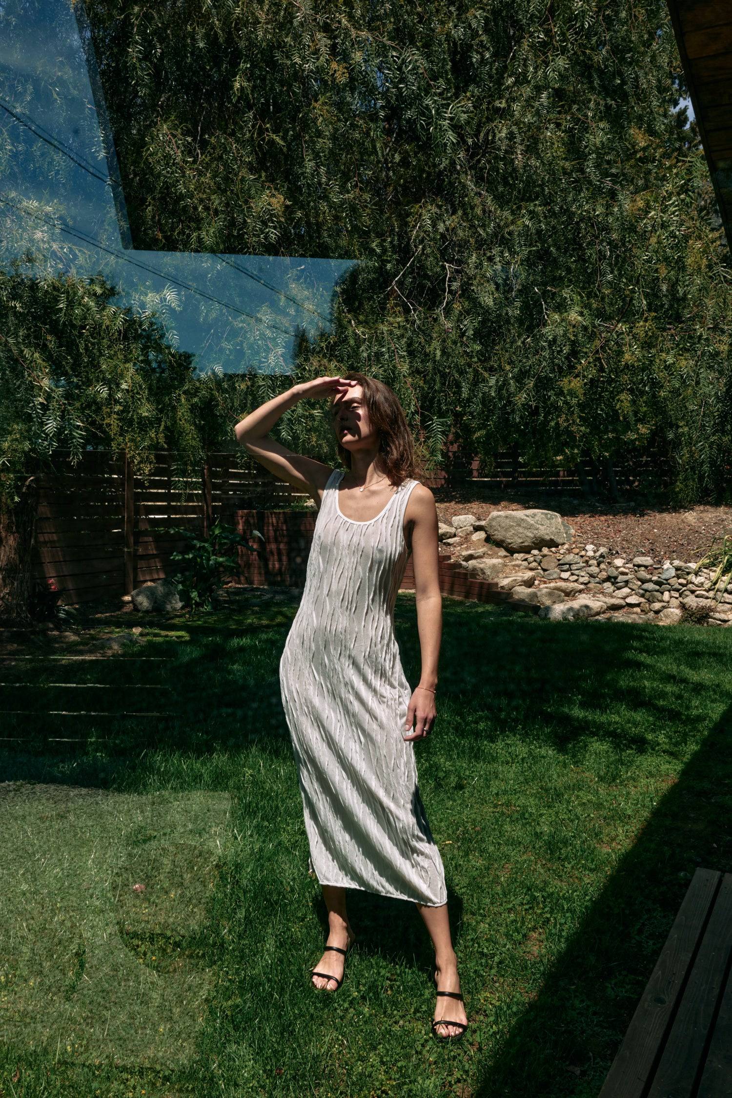 8861267755229, The Aliya Dress, Dress, All Row, Black,bodycon,brown,Casual,cf-color-black,cf-color-ivory,cf-size-l,cf-size-m,cf-size-s,cinched,ivory,Midi,new,nylon,racerback,rust,Sleeveless,Sleeveless Dress,Slit,spring,straight-cut,summer,texture,textured,Textured Fabric,viscose,Women's, Information The Aliya Dress is a tank midi dress that is crafted from a textured, pintucked stretch fabric. It boasts a sheer bodice and a scoop neckline. A summer addition piece to dress up or wear casually. Details Self: