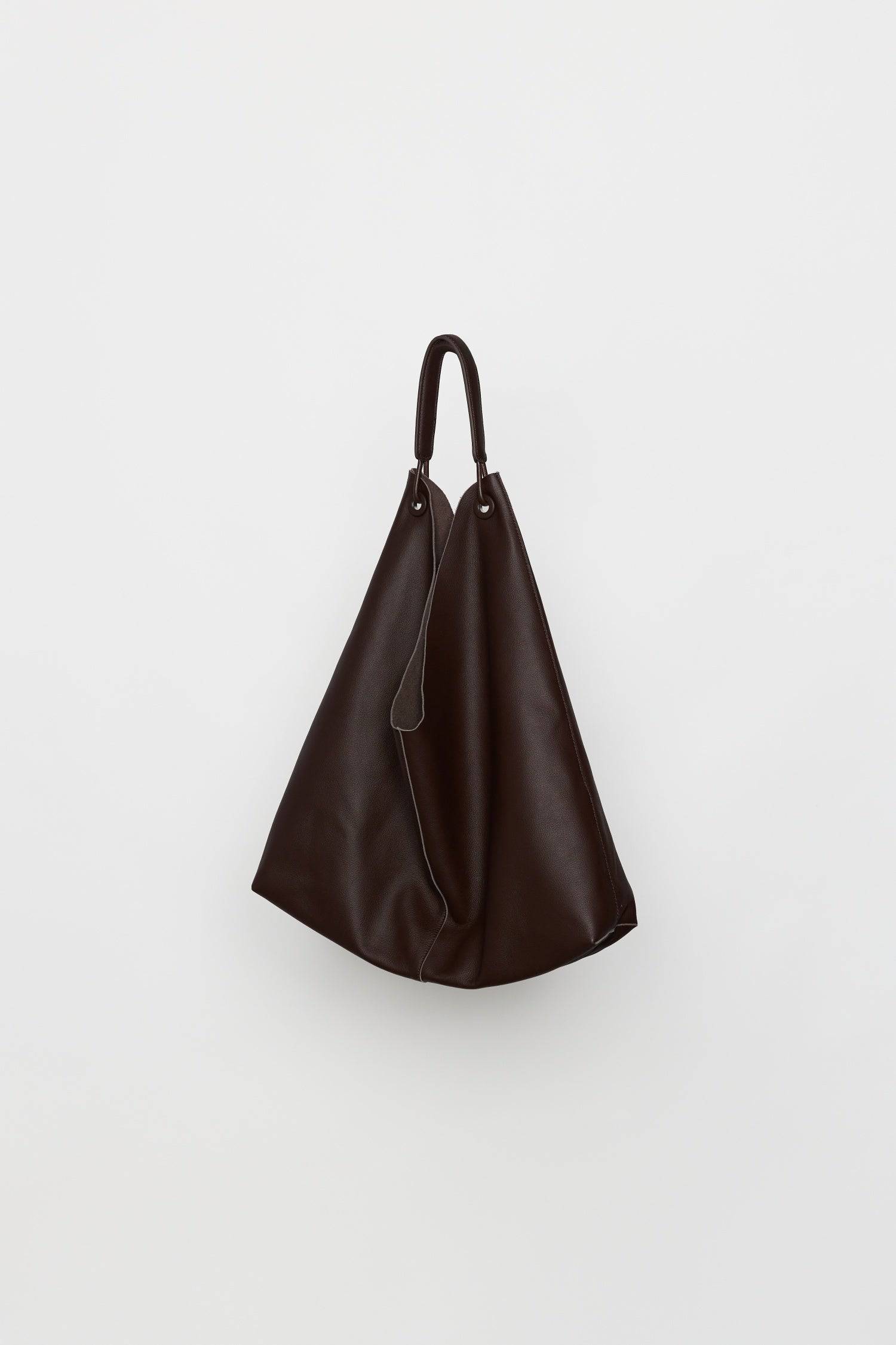 8857790644445, The Kenzie Bindle Bag, Bags, Mod Ref | Common Market, accessories,bag,bags,cf-color-khaki,cf-color-white,cf-vendor-mod-ref-common-market,dark brown,modrefcommonmarket,Oversized,purse, Information The Kenzie Bindle Bag is a spacious, oversized shoulder bag crafted from 100% cowhide combining lasting durability with a refined, natural texture. Designed for both style and practicality, it features an open top for easy access, a secure interior zipper pocket, and a soft suede lining for a touch o
