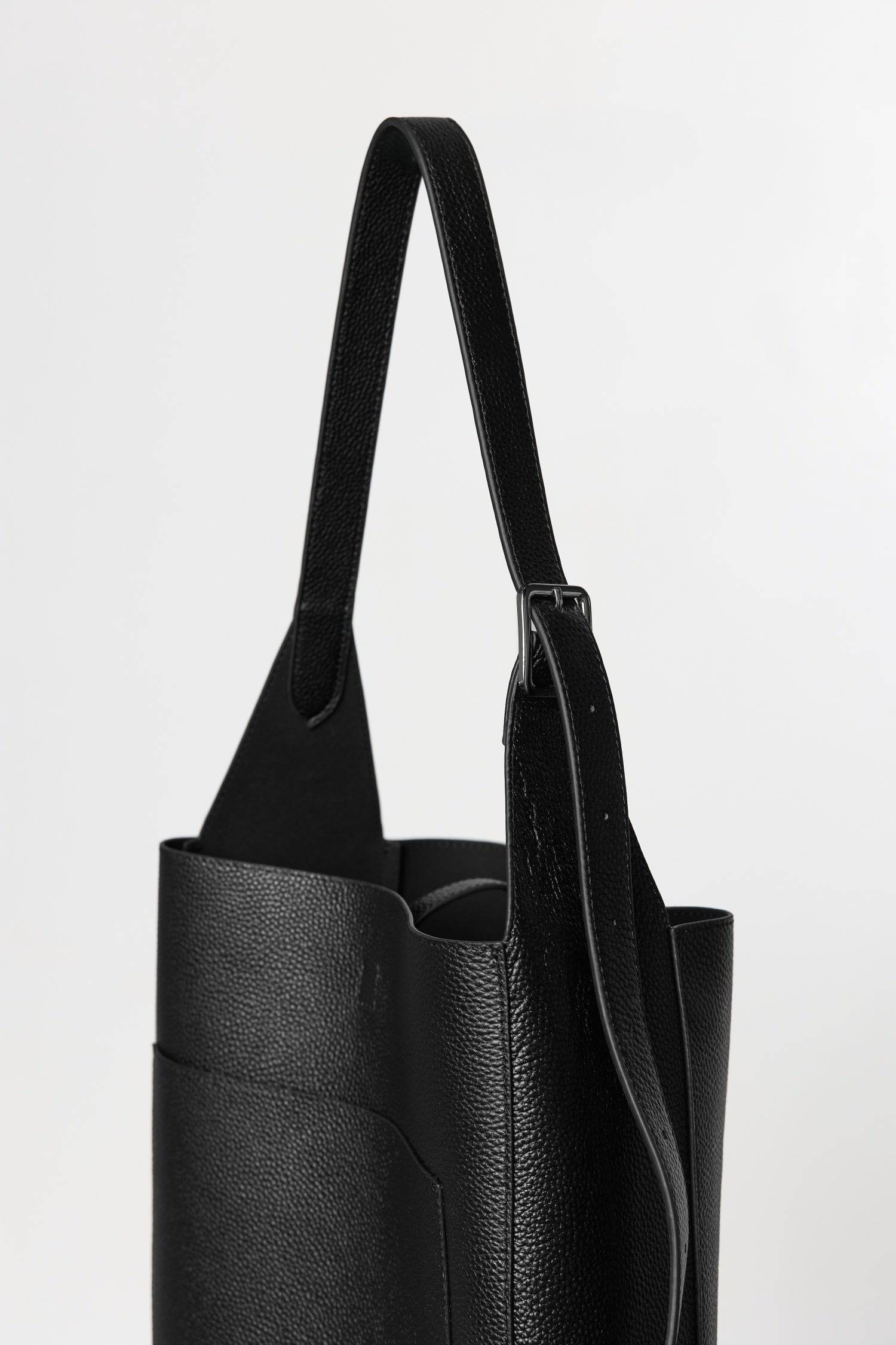 8857790087389, The Brighton Tote Bag, Bags, Mod Ref | Common Market, accessories,bag,bags,cf-color-khaki,cf-color-white,cf-vendor-mod-ref-common-market,dark brown,modrefcommonmarket,Oversized,purse, Information The Brighton Tote Bag is designed with a top snap closure and an exterior slip pocket for easy access to your essentials. It's designed with an adjustable leather shoulder strap for a custom fit and includes a detachable leather pouch for added convenience and organization. Details 100% Cowhide Top S