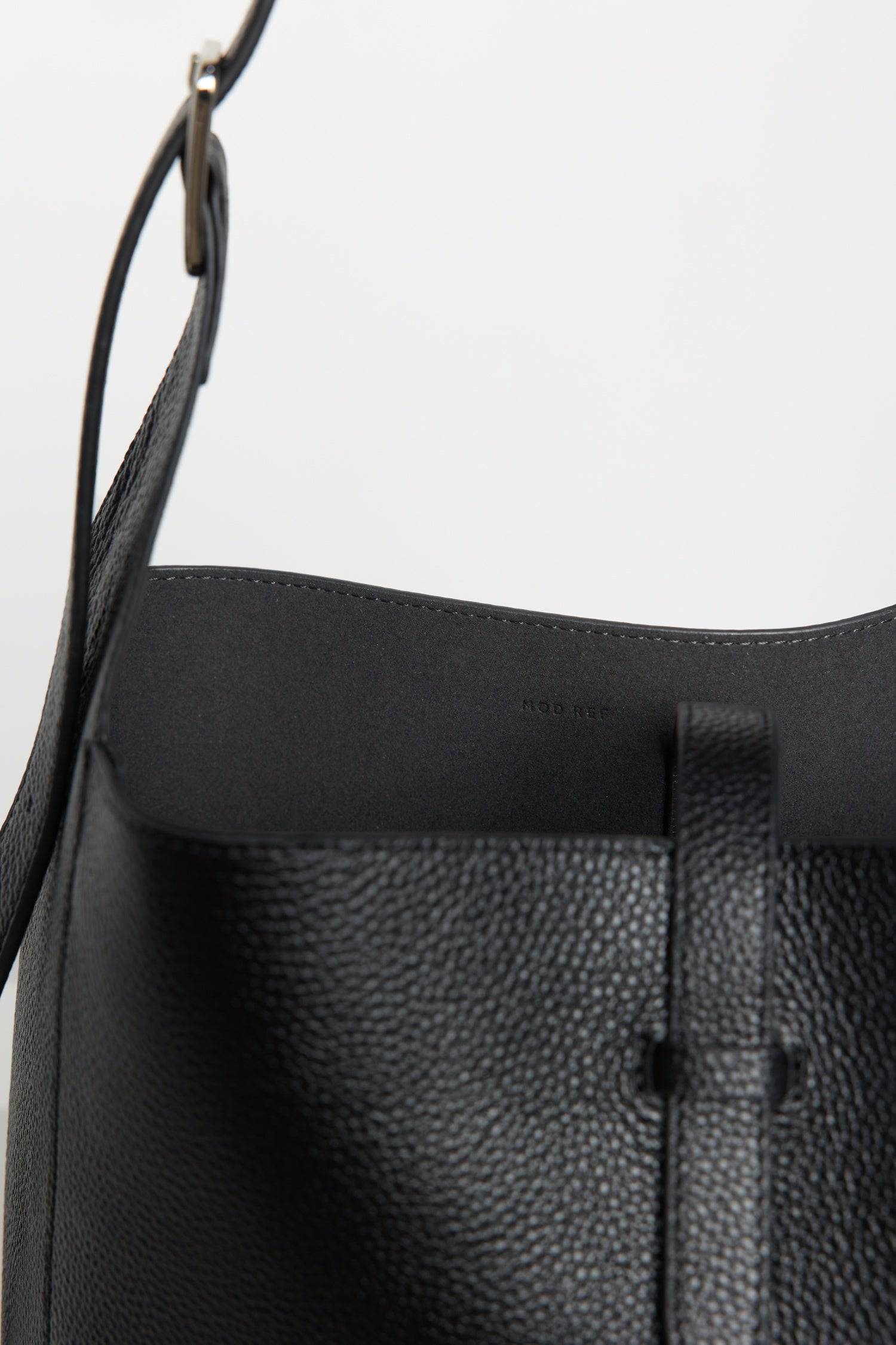 8857790087389, The Brighton Tote Bag, Bags, Mod Ref | Common Market, accessories,bag,bags,cf-color-khaki,cf-color-white,cf-vendor-mod-ref-common-market,dark brown,modrefcommonmarket,Oversized,purse, Information The Brighton Tote Bag is designed with a top snap closure and an exterior slip pocket for easy access to your essentials. It's designed with an adjustable leather shoulder strap for a custom fit and includes a detachable leather pouch for added convenience and organization. Details 100% Cowhide Top S