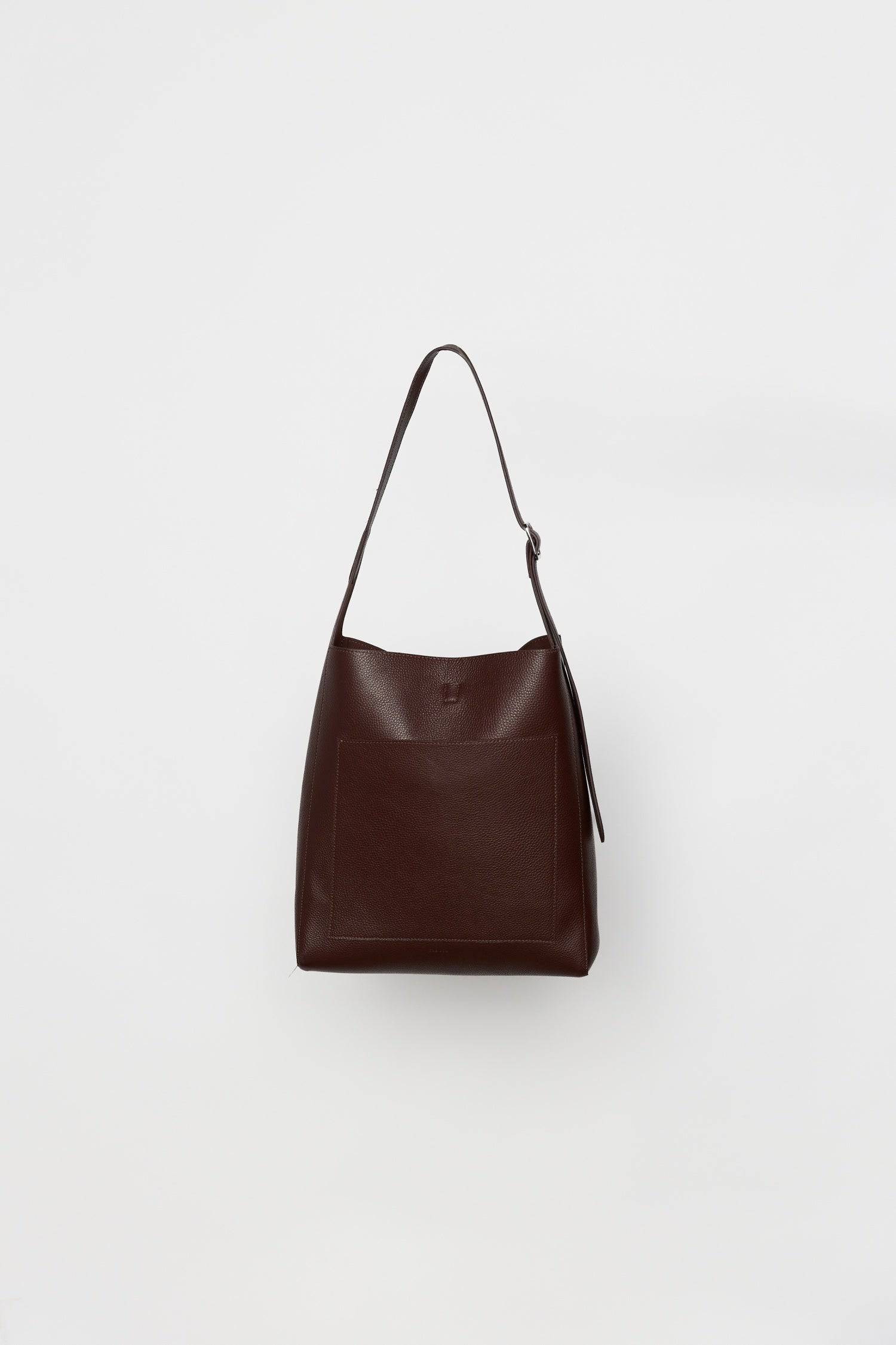 8857790087389, The Brighton Tote Bag, Bags, Mod Ref | Common Market, accessories,bag,bags,cf-color-khaki,cf-color-white,cf-vendor-mod-ref-common-market,dark brown,modrefcommonmarket,Oversized,purse, Information The Brighton Tote Bag is designed with a top snap closure and an exterior slip pocket for easy access to your essentials. It's designed with an adjustable leather shoulder strap for a custom fit and includes a detachable leather pouch for added convenience and organization. Details 100% Cowhide Top S