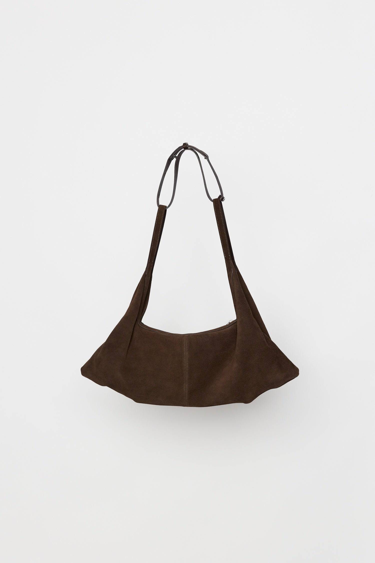 8857769345245, The Erin Shoulder Bag, Bags, Mod Ref | Common Market, accessories,bag,bags,cf-color-khaki,cf-color-white,cf-vendor-mod-ref-common-market,dark brown,modrefcommonmarket,Oversized,purse, Information The Erin Shoulder Bag features a relaxed, slouchy shape with a center seam detail and is crafted from suede leather for a modern look. The zip closure, inner pocket console, and detachable top strap offer both practicality and versatility for everyday use. Details 100% Cowhide Slouchy Shape Suede Lea