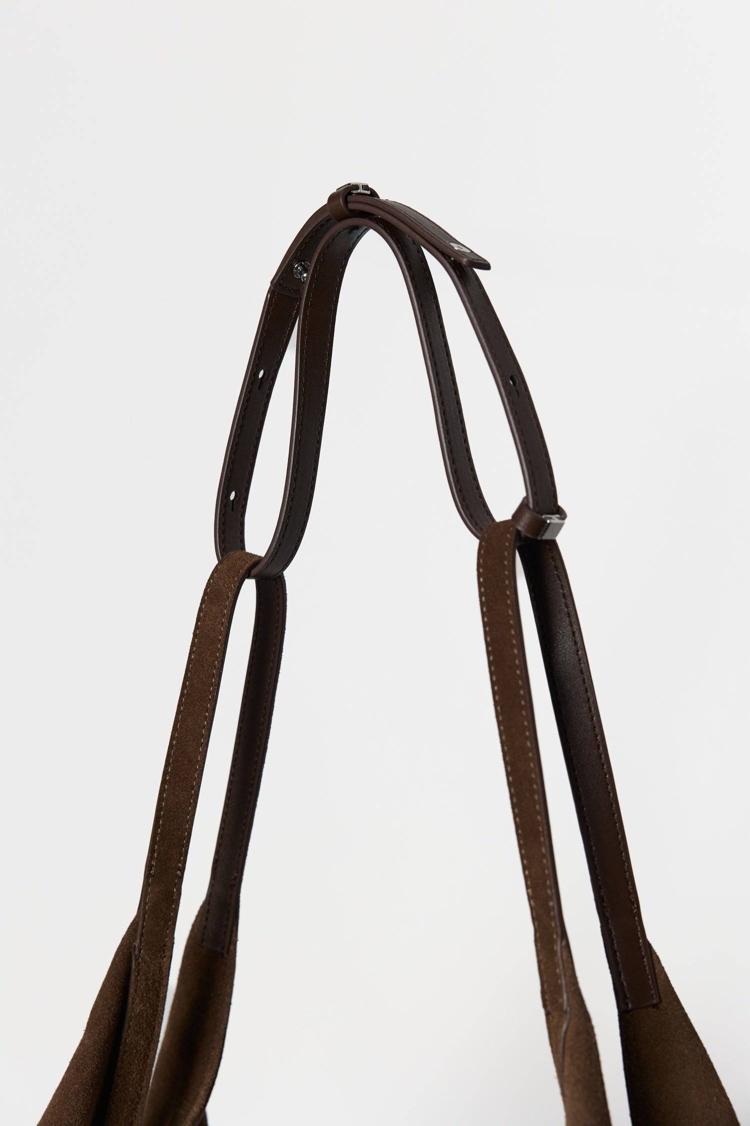 8857769345245, The Erin Shoulder Bag, Bags, Mod Ref | Common Market, accessories,bag,bags,cf-color-khaki,cf-color-white,cf-vendor-mod-ref-common-market,dark brown,modrefcommonmarket,Oversized,purse, Information The Erin Shoulder Bag features a relaxed, slouchy shape with a center seam detail and is crafted from suede leather for a modern look. The zip closure, inner pocket console, and detachable top strap offer both practicality and versatility for everyday use. Details 100% Cowhide Slouchy Shape Suede Lea