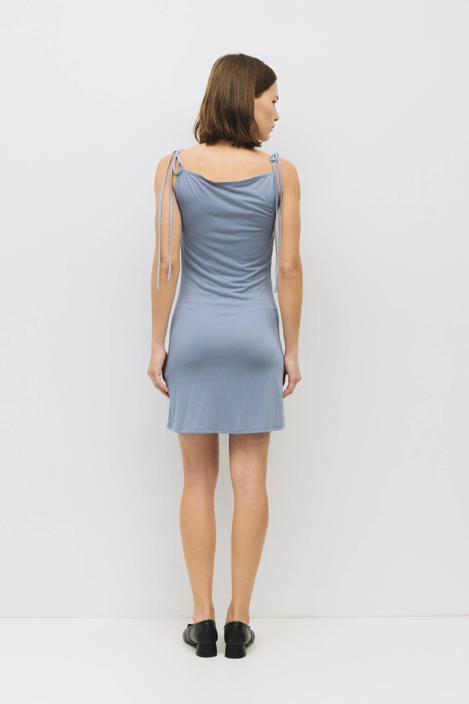 9023650955485, The Parker Mini Dress, Dress, All Row, All Row,allrow,Blue,Casual,cf-color-blue,cf-color-charcoal,cf-size-l,cf-size-m,cf-size-s,cf-vendor-all-row,Charcoal,Cowl,cowl neck,cupro,Draped,Dress,Feminine,Form Fitting,mini,Mini Dress,modal,new,Spring,Summer,thin,ties,Women's, Information The Parker Mini Dress is a sleeveless, fitted cupro dress featuring a front cowl neckline and tie shoulder details. Its mini length and sleek silhouette make it a flattering and effortless option for warmer days. De