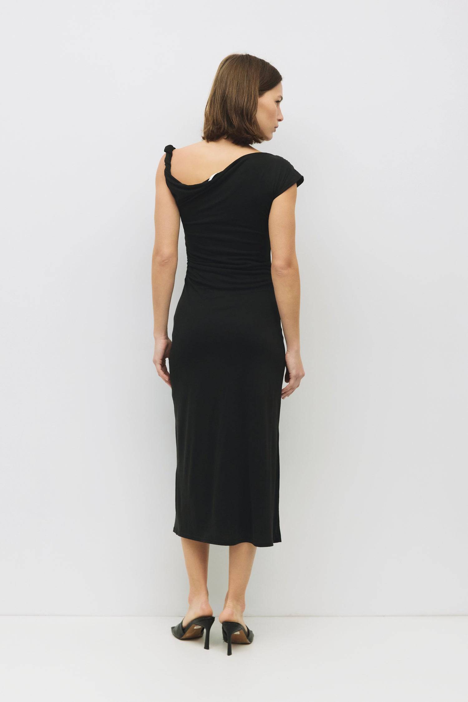 8983742251229, The Itria Dress, Dress, All Row, Black,Casual,cf-color-black,cf-color-red,cf-color-white,cf-size-l,cf-vendor-all-row,collared,Comfort,Comfortable,Feminine,full skirt,Midi,Midi Dress,midi length,new,Red,Sleeveless,Sleeveless Dress,Spring,versatile,white,Womens, Information The Itria Dress is a fitted maxi dress featuring a twisted shoulder strap, asymmetrical neckline, and a shirred waistline for added shape. Its sleek design offers a modern, flattering silhouette perfect for both casual and d