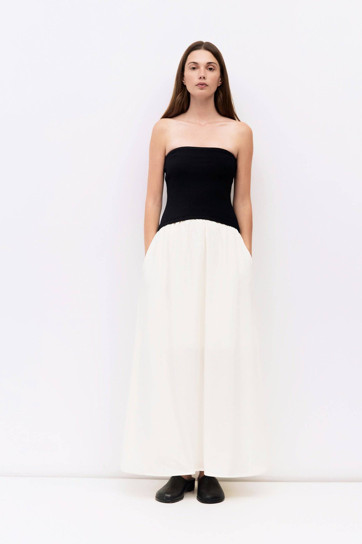 9061529747677, The Stefani Dress, Dress, All Row, cf-size-l,cf-vendor-all-row,collared,Comfort,Comfortable,Feminine,merrow edge,mini,new,Spring,strapless,Summer,textured,Textured Fabric,Transitional,versatile,Womens, Information The Stefani Dress pairs a fitted, strapless knit bodice with a lightweight, shirred midi skirt for a flattering two-tone silhouette. Side pockets add a practical touch to this effortlessly chic piece. Details Self: 100% Recycled Polyester, Contrast: 65% Viscose, 35% Nylon Strapless