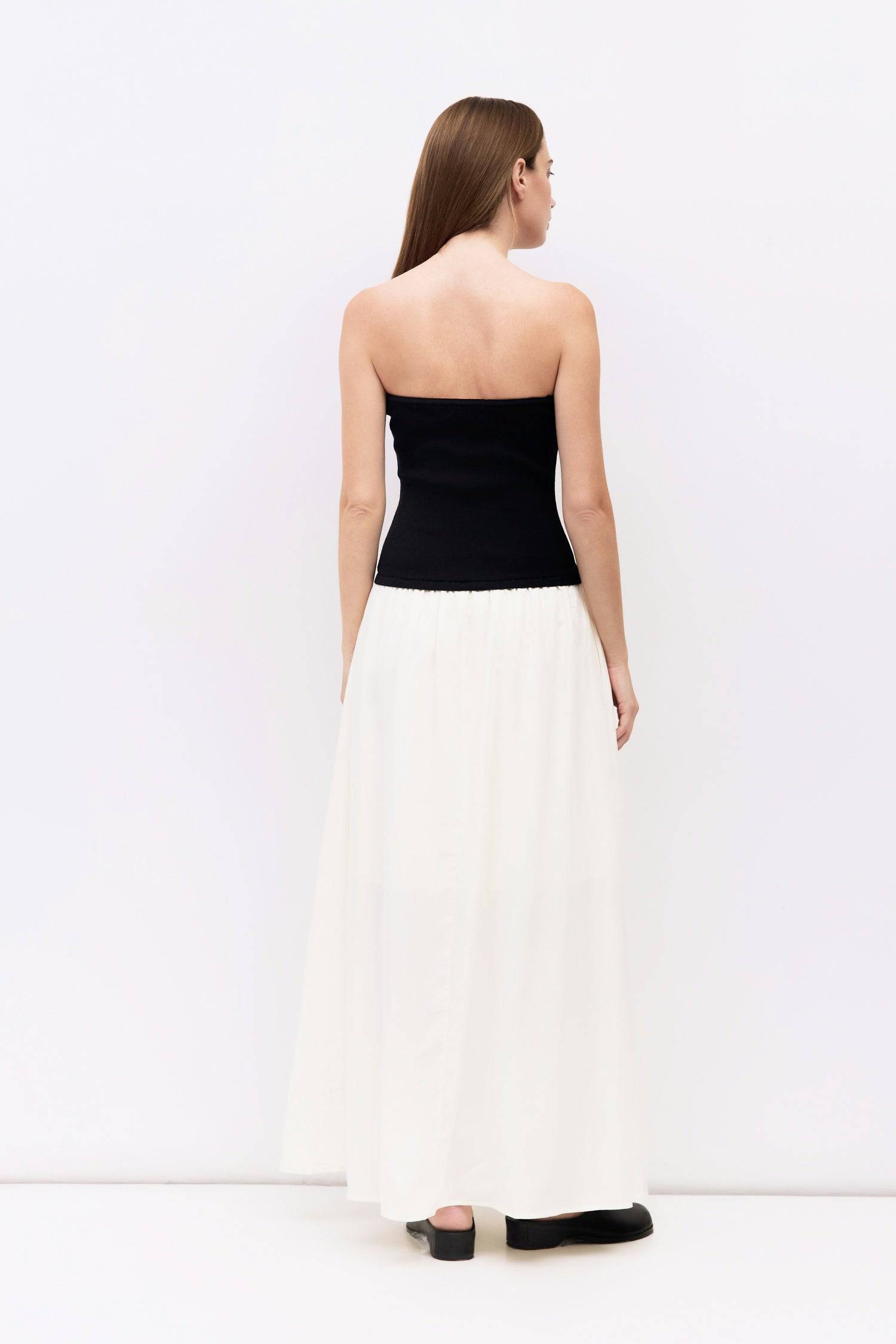 9061529747677, The Stefani Dress, Dress, All Row, cf-size-l,cf-vendor-all-row,collared,Comfort,Comfortable,Feminine,merrow edge,mini,new,Spring,strapless,Summer,textured,Textured Fabric,Transitional,versatile,Womens, Information The Stefani Dress pairs a fitted, strapless knit bodice with a lightweight, shirred midi skirt for a flattering two-tone silhouette. Side pockets add a practical touch to this effortlessly chic piece. Details Self: 100% Recycled Polyester, Contrast: 65% Viscose, 35% Nylon Strapless