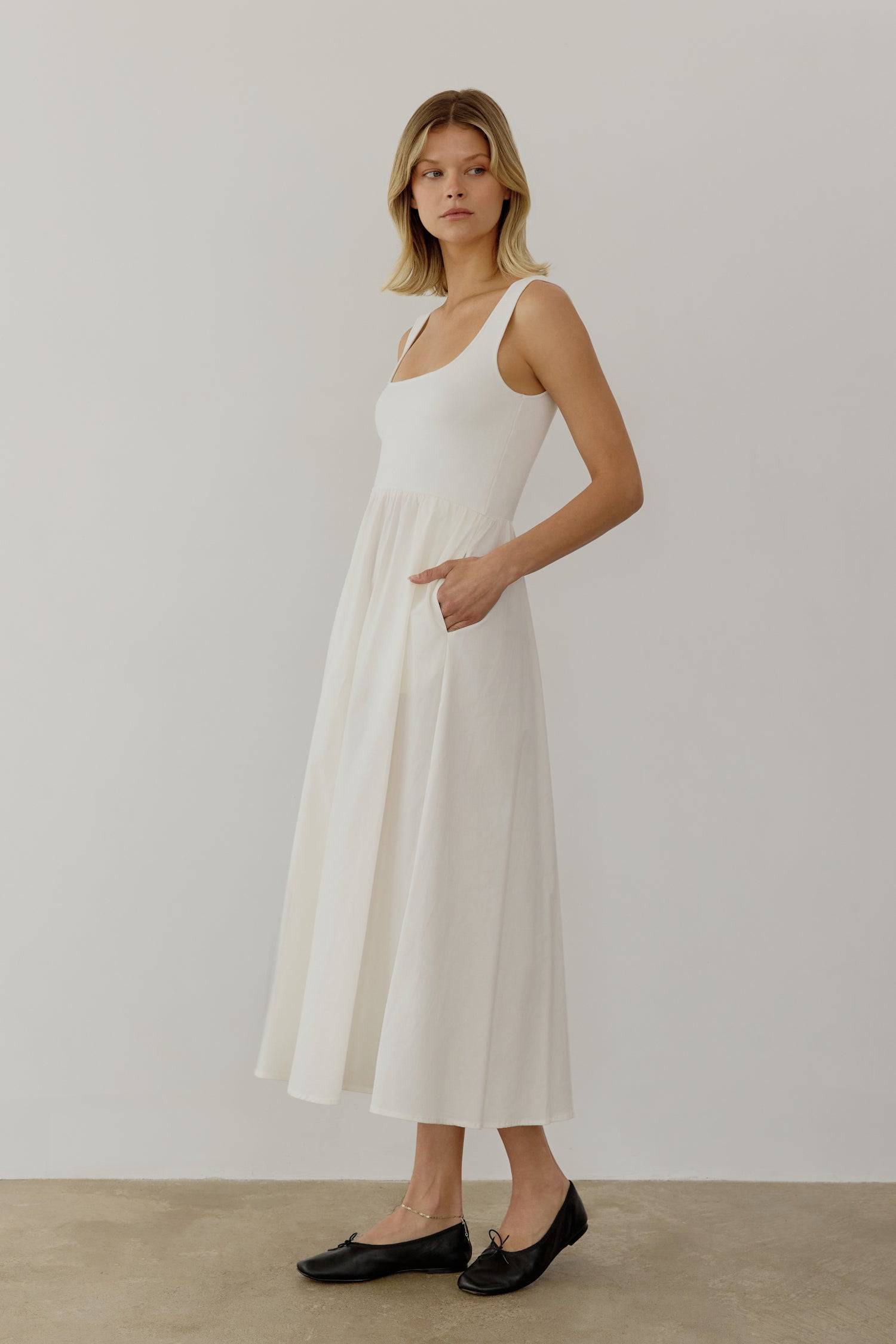 8085492793565, The Lucinda Dress, Dress, All Row, cf-color-white,cf-size-l,cf-size-m,cf-size-s,Cream,Dress,everyday,Front Pockets,ivory,Knit,Long Dress,Maxi,maxi dress,Navy,Pocket,Pockets,Relaxed,Relaxed Fit,spring,Square Back,Square Neckline,Squared Neckline,Summer,tank,tank dress,white, Information The Lucinda Dress is a maxi-length dress with a knit square neckline top and a woven full skirt. The different fabrics create visual interest in this classic silhouette. This style also includes hidden side poc