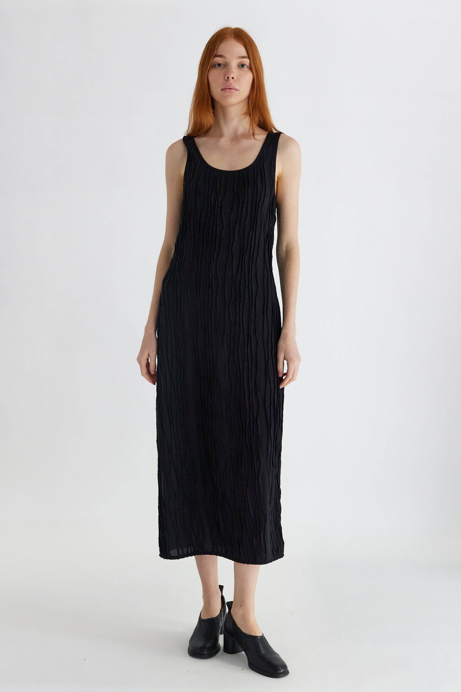 8861267755229, The Aliya Dress, Dress, All Row, Black,bodycon,brown,Casual,cf-color-black,cf-color-ivory,cf-size-l,cf-size-m,cf-size-s,cinched,ivory,Midi,new,nylon,racerback,rust,Sleeveless,Sleeveless Dress,Slit,spring,straight-cut,summer,texture,textured,Textured Fabric,viscose,Women's, Information The Aliya Dress is a tank midi dress that is crafted from a textured, pintucked stretch fabric. It boasts a sheer bodice and a scoop neckline. A summer addition piece to dress up or wear casually. Details Self: