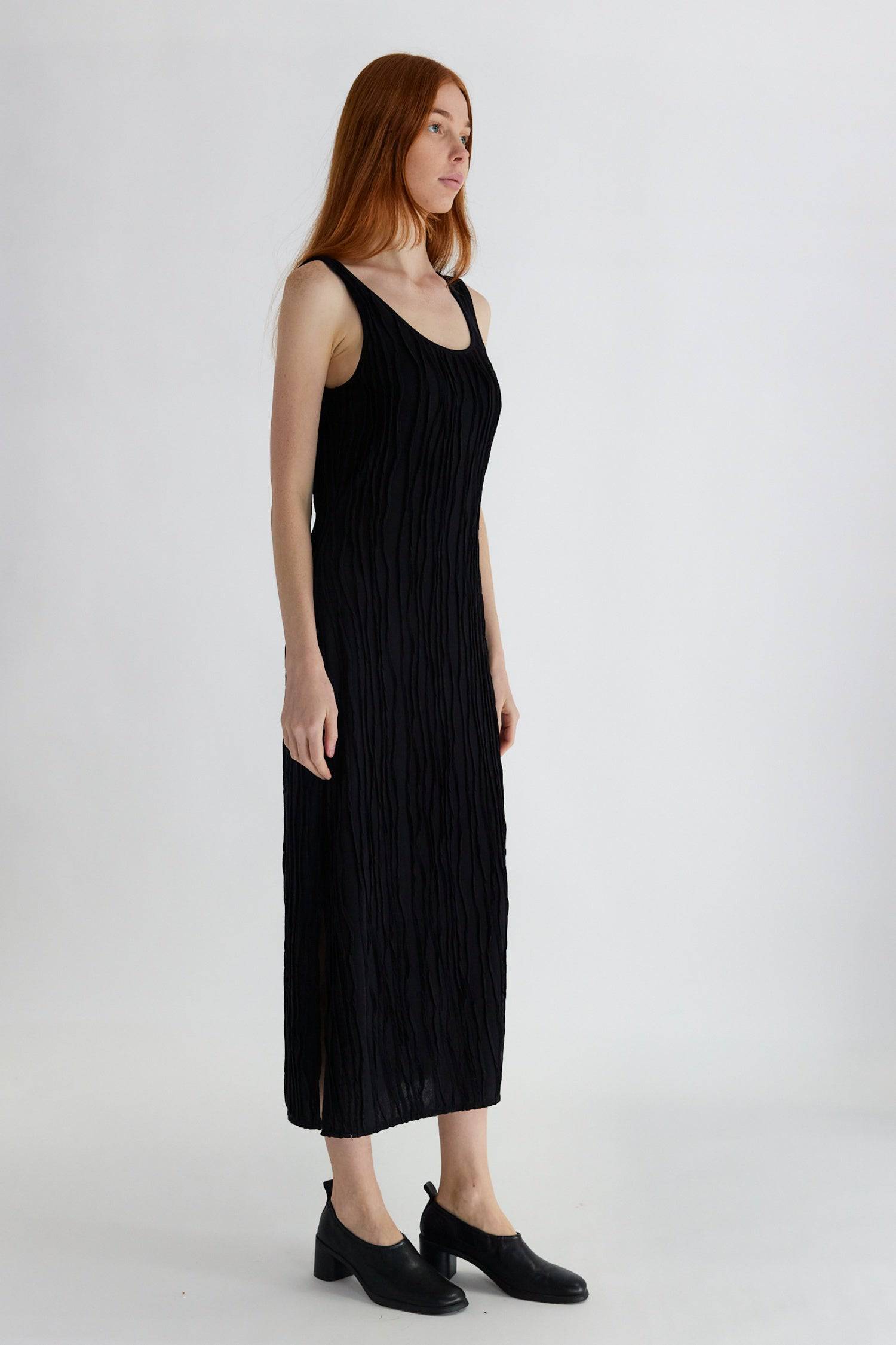 8861267755229, The Aliya Dress, Dress, All Row, Black,bodycon,brown,Casual,cf-color-black,cf-color-ivory,cf-size-l,cf-size-m,cf-size-s,cinched,ivory,Midi,new,nylon,racerback,rust,Sleeveless,Sleeveless Dress,Slit,spring,straight-cut,summer,texture,textured,Textured Fabric,viscose,Women's, Information The Aliya Dress is a tank midi dress that is crafted from a textured, pintucked stretch fabric. It boasts a sheer bodice and a scoop neckline. A summer addition piece to dress up or wear casually. Details Self: