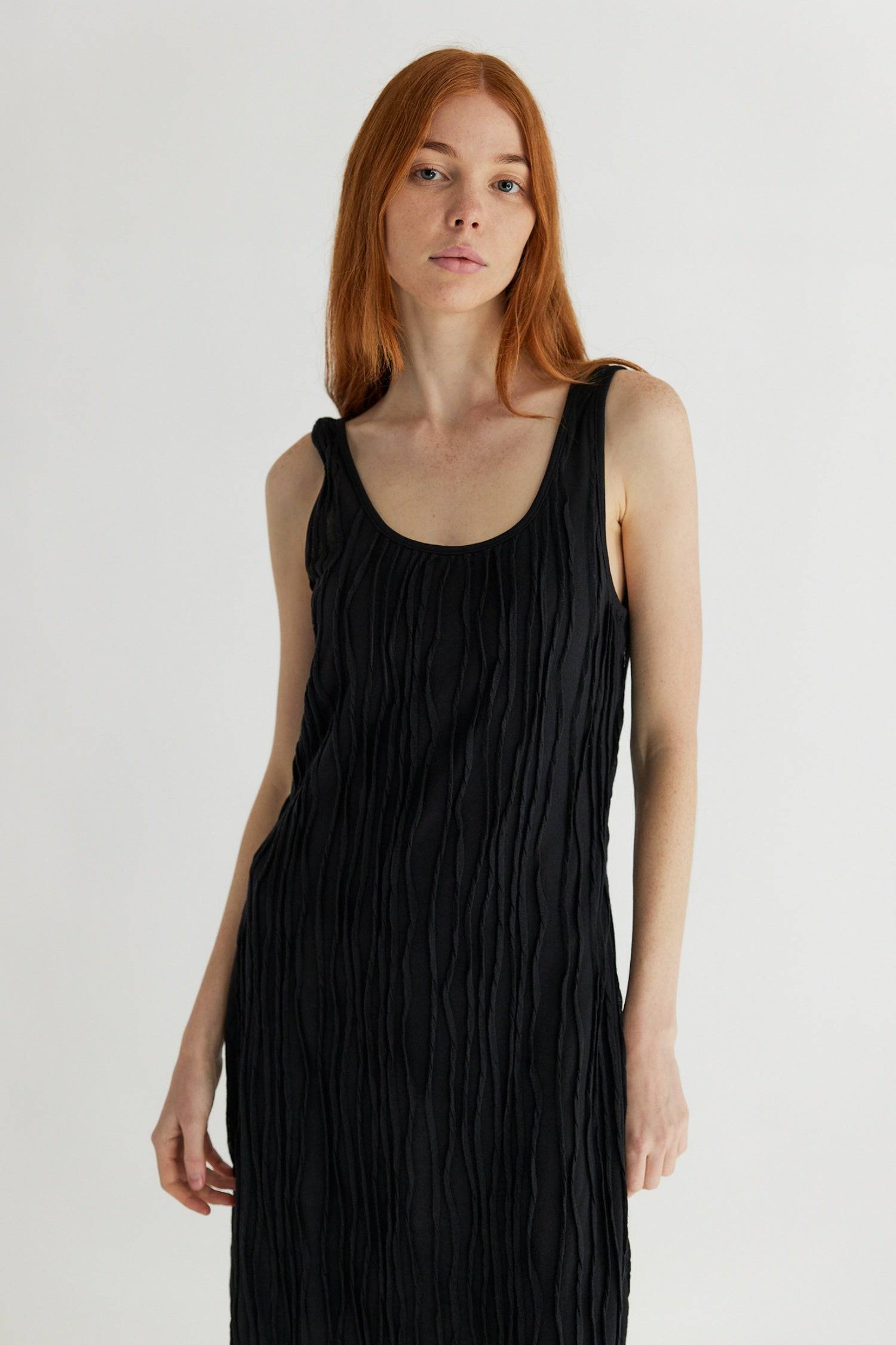 8861267755229, The Aliya Dress, Dress, All Row, Black,bodycon,brown,Casual,cf-color-black,cf-color-ivory,cf-size-l,cf-size-m,cf-size-s,cinched,ivory,Midi,new,nylon,racerback,rust,Sleeveless,Sleeveless Dress,Slit,spring,straight-cut,summer,texture,textured,Textured Fabric,viscose,Women's, Information The Aliya Dress is a tank midi dress that is crafted from a textured, pintucked stretch fabric. It boasts a sheer bodice and a scoop neckline. A summer addition piece to dress up or wear casually. Details Self: