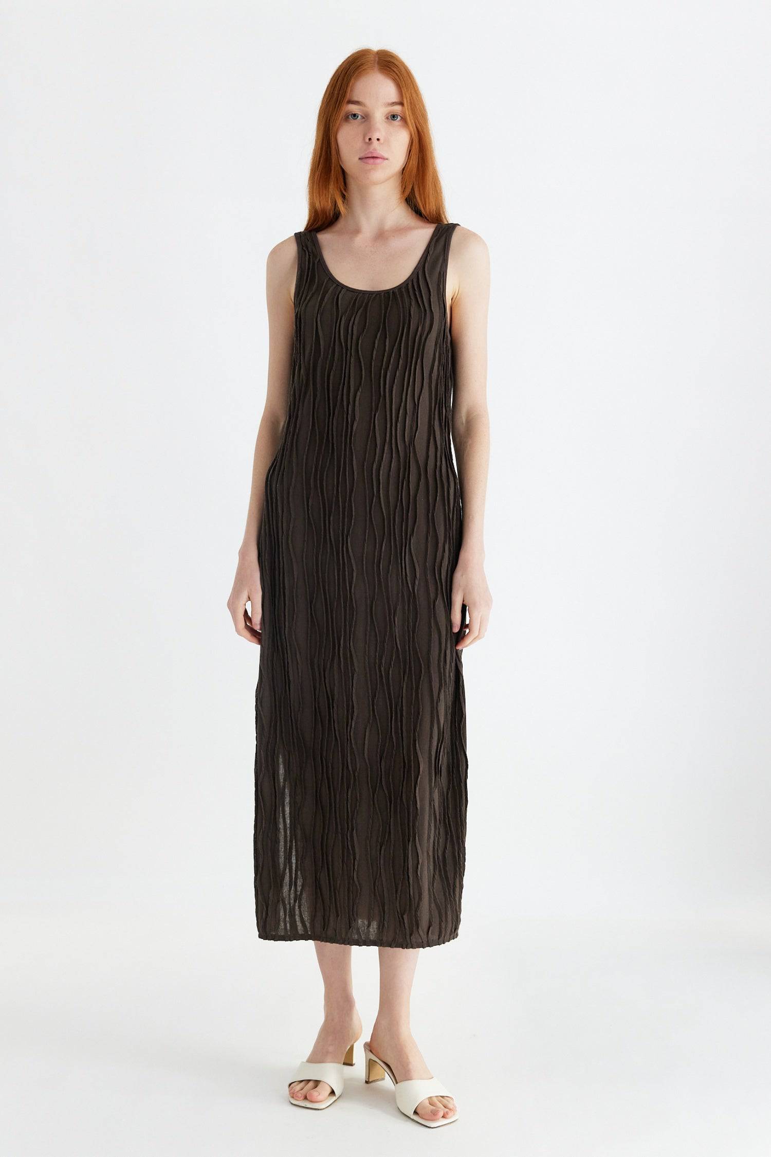 8861267755229, The Aliya Dress, Dress, All Row, Black,bodycon,brown,Casual,cf-color-black,cf-color-ivory,cf-size-l,cf-size-m,cf-size-s,cinched,ivory,Midi,new,nylon,racerback,rust,Sleeveless,Sleeveless Dress,Slit,spring,straight-cut,summer,texture,textured,Textured Fabric,viscose,Women's, Information The Aliya Dress is a tank midi dress that is crafted from a textured, pintucked stretch fabric. It boasts a sheer bodice and a scoop neckline. A summer addition piece to dress up or wear casually. Details Self: