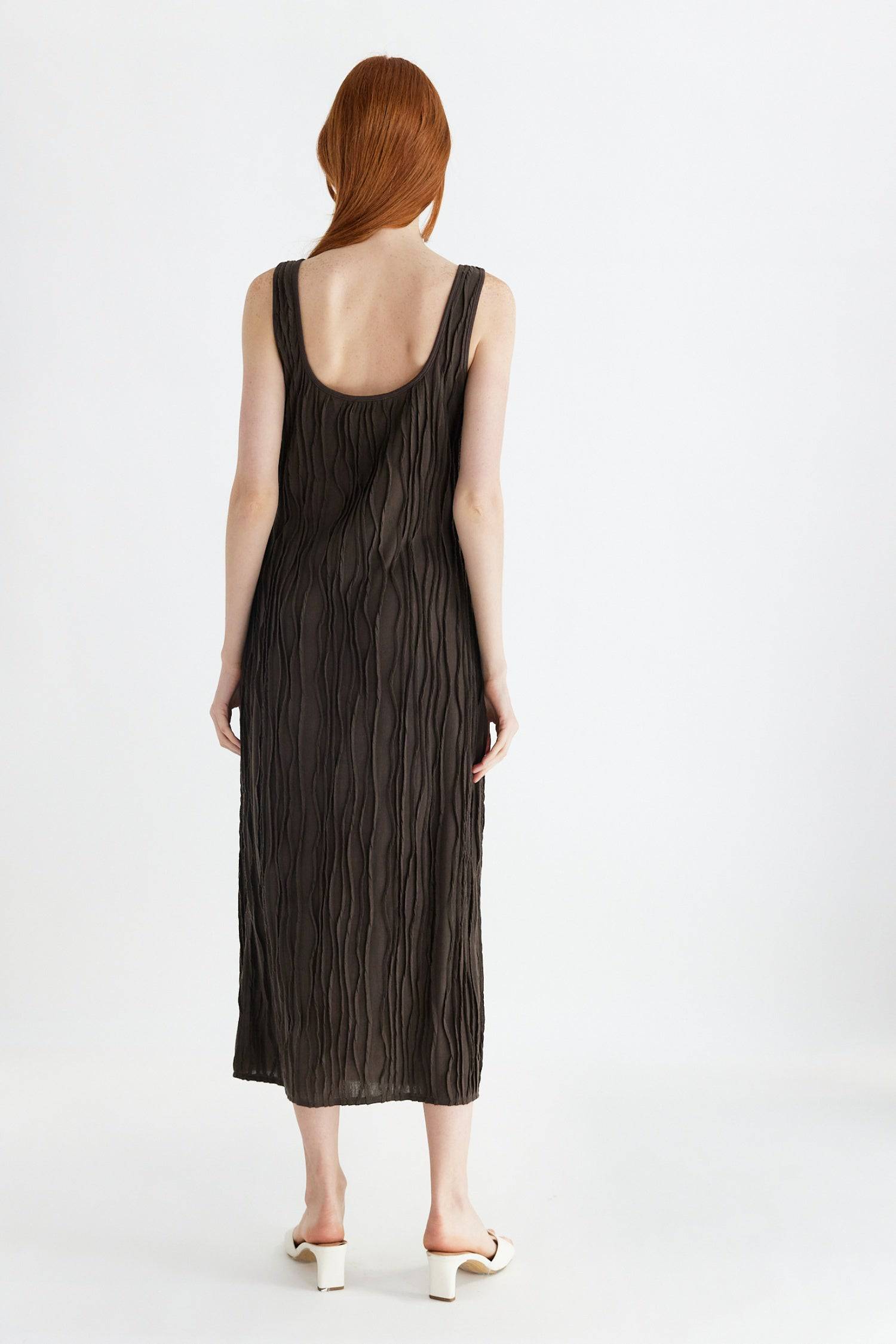 8861267755229, The Aliya Dress, Dress, All Row, Black,bodycon,brown,Casual,cf-color-black,cf-color-ivory,cf-size-l,cf-size-m,cf-size-s,cinched,ivory,Midi,new,nylon,racerback,rust,Sleeveless,Sleeveless Dress,Slit,spring,straight-cut,summer,texture,textured,Textured Fabric,viscose,Women's, Information The Aliya Dress is a tank midi dress that is crafted from a textured, pintucked stretch fabric. It boasts a sheer bodice and a scoop neckline. A summer addition piece to dress up or wear casually. Details Self: