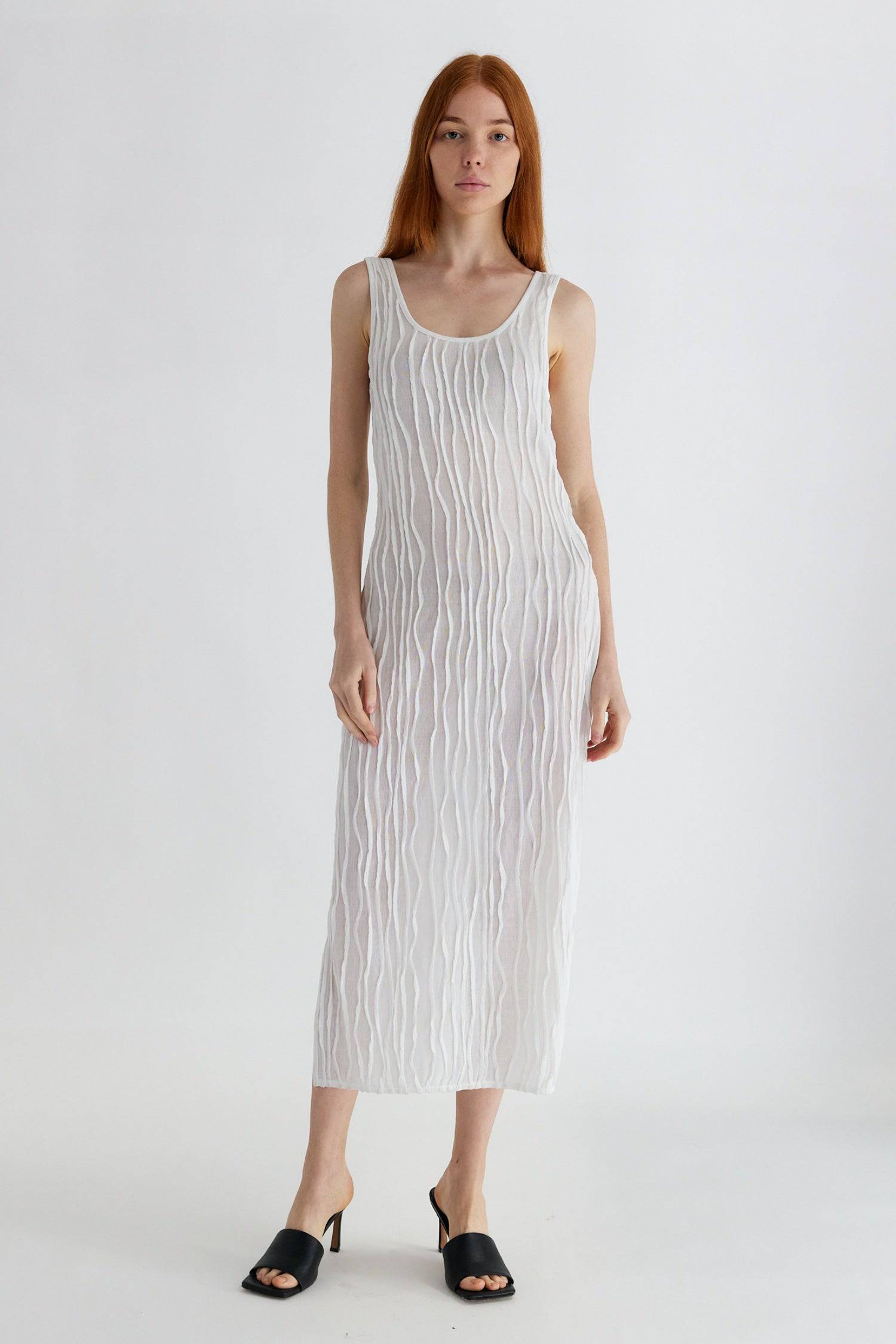 8861267755229, The Aliya Dress, Dress, All Row, Black,bodycon,brown,Casual,cf-color-black,cf-color-ivory,cf-size-l,cf-size-m,cf-size-s,cinched,ivory,Midi,new,nylon,racerback,rust,Sleeveless,Sleeveless Dress,Slit,spring,straight-cut,summer,texture,textured,Textured Fabric,viscose,Women's, Information The Aliya Dress is a tank midi dress that is crafted from a textured, pintucked stretch fabric. It boasts a sheer bodice and a scoop neckline. A summer addition piece to dress up or wear casually. Details Self: