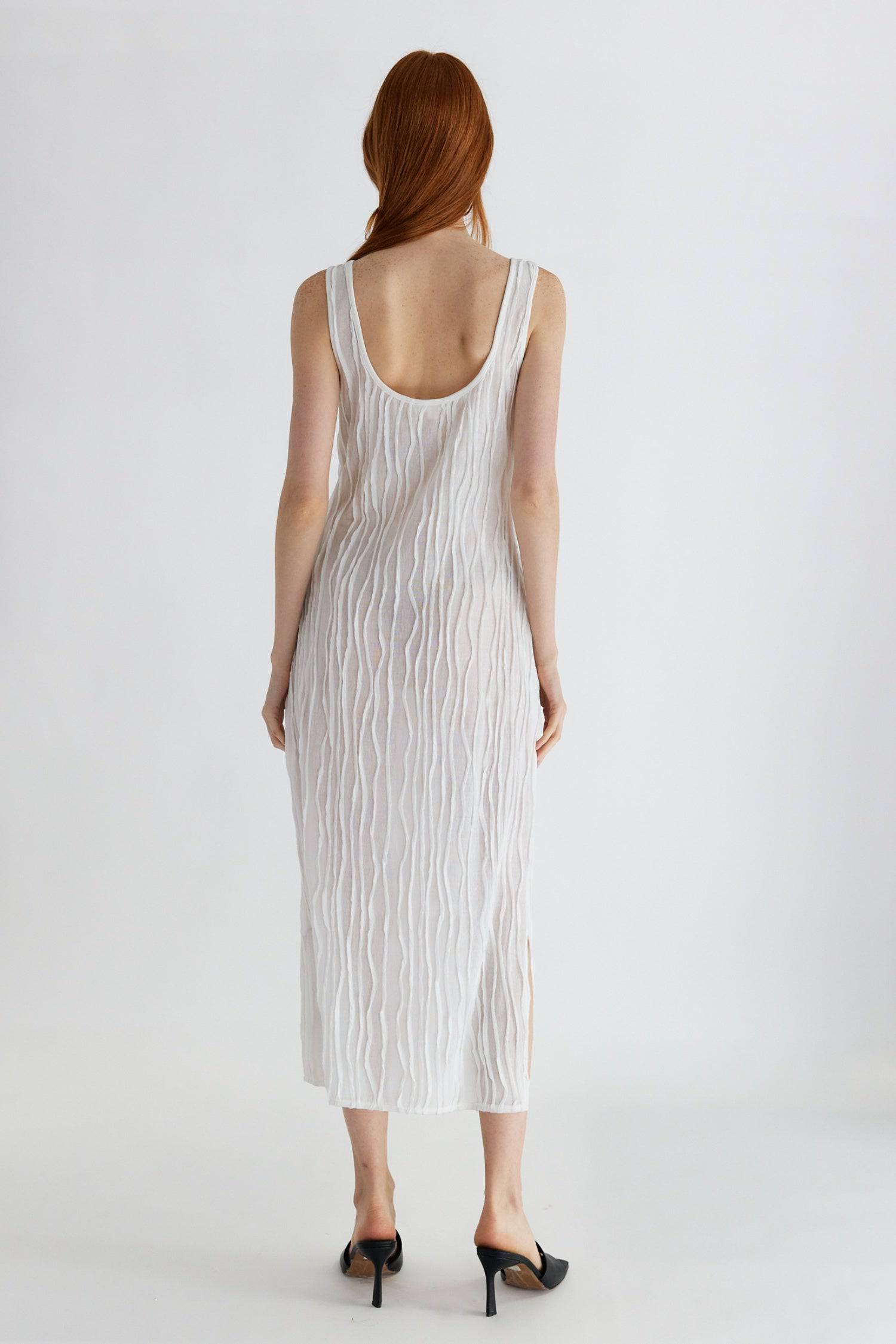 8861267755229, The Aliya Dress, Dress, All Row, Black,bodycon,brown,Casual,cf-color-black,cf-color-ivory,cf-size-l,cf-size-m,cf-size-s,cinched,ivory,Midi,new,nylon,racerback,rust,Sleeveless,Sleeveless Dress,Slit,spring,straight-cut,summer,texture,textured,Textured Fabric,viscose,Women's, Information The Aliya Dress is a tank midi dress that is crafted from a textured, pintucked stretch fabric. It boasts a sheer bodice and a scoop neckline. A summer addition piece to dress up or wear casually. Details Self: