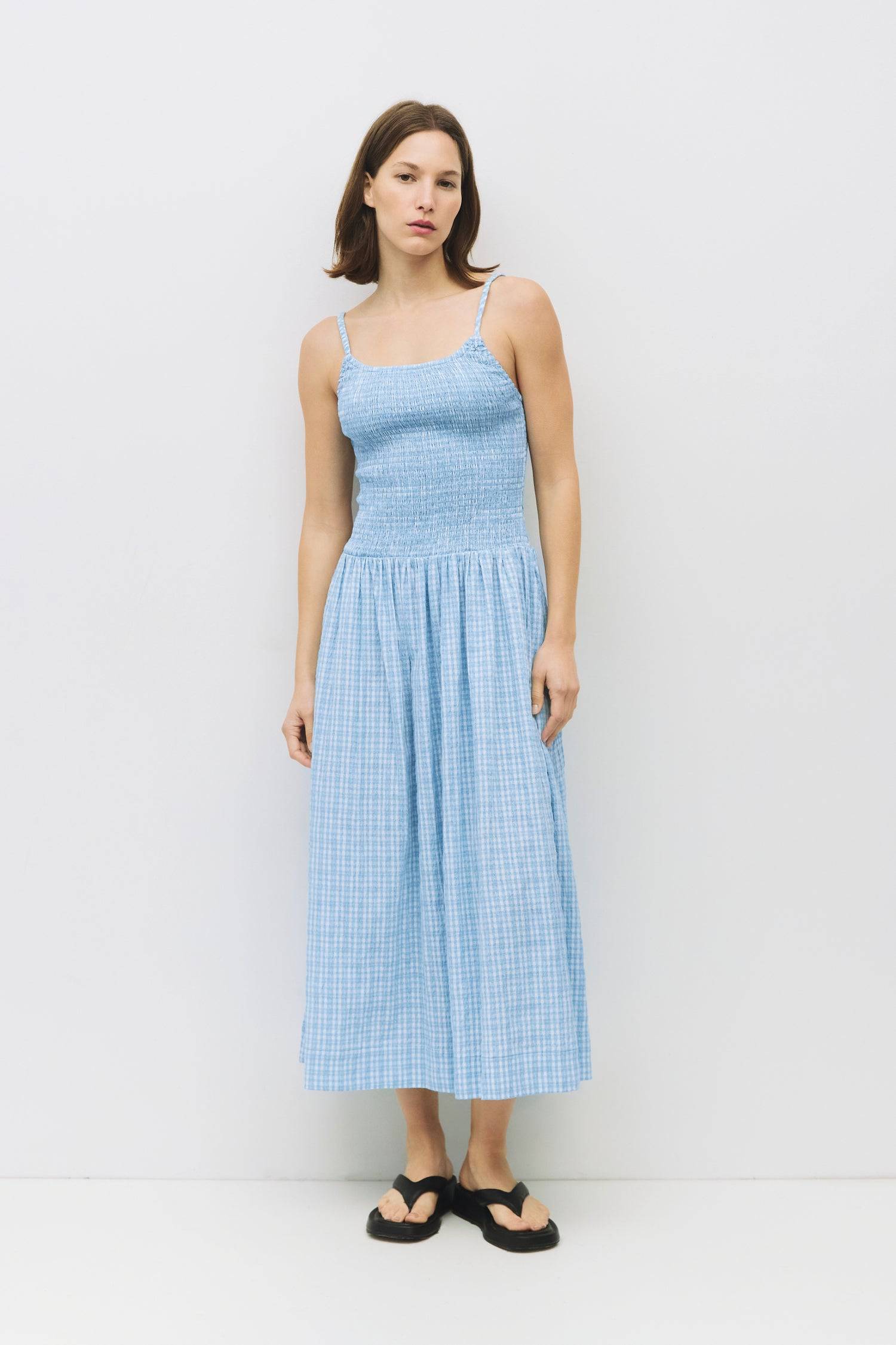 8988733636829, The Ebony Dress, Dress, All Row, brown,Casual,cf-color-chestnut,cf-color-natural,cf-color-white,cf-size-l,cf-size-m,cf-size-s,cf-vendor-all-row,Chestnut Brown,Comfort,Comfortable,dark brown,Feminine,Midi,Midi Dress,midi length,Minimal,natural,new,Pockets,Semi-Formal,side pockets,Sleeveless,Sleeveless Dress,Slight Flare,Smocked,Spring,versatile,white,Womens, Information The Ebony Dress is a midi-length, fit-and-flare style with a textured plaid print and elasticated shoulder straps for added c