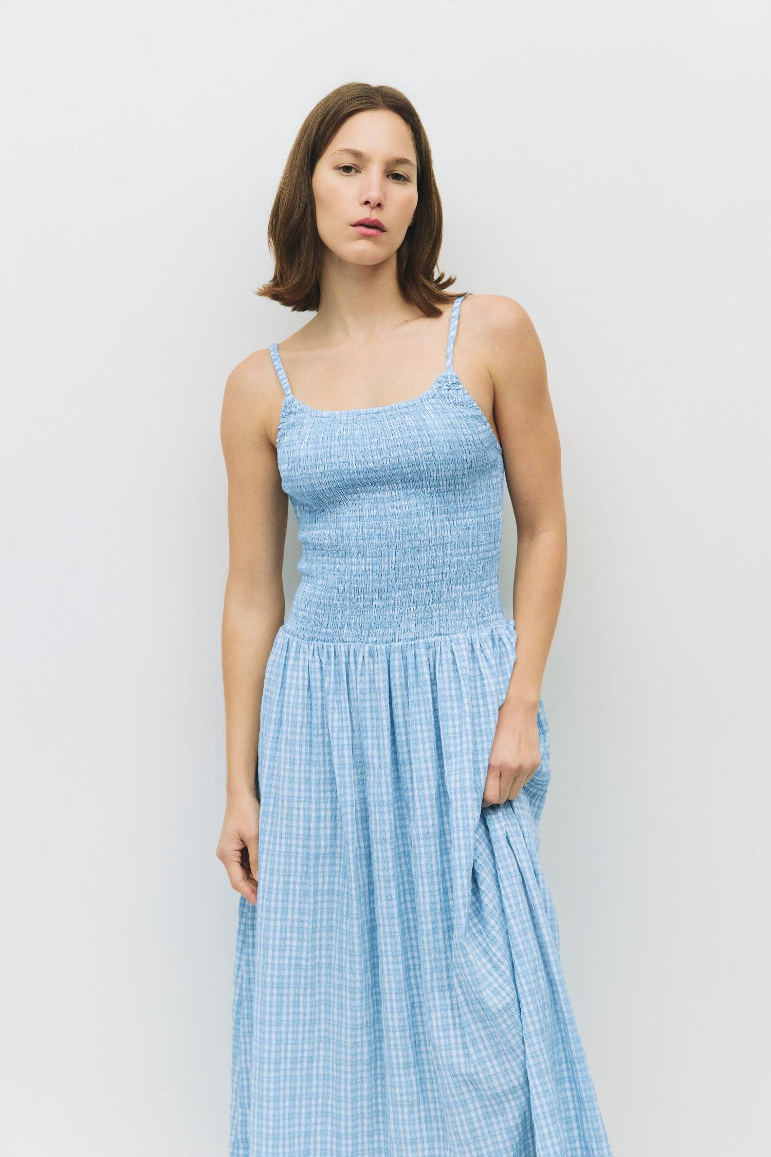 8988733636829, The Ebony Dress, Dress, All Row, brown,Casual,cf-color-chestnut,cf-color-natural,cf-color-white,cf-size-l,cf-size-m,cf-size-s,cf-vendor-all-row,Chestnut Brown,Comfort,Comfortable,dark brown,Feminine,Midi,Midi Dress,midi length,Minimal,natural,new,Pockets,Semi-Formal,side pockets,Sleeveless,Sleeveless Dress,Slight Flare,Smocked,Spring,versatile,white,Womens, Information The Ebony Dress is a midi-length, fit-and-flare style with a textured plaid print and elasticated shoulder straps for added c