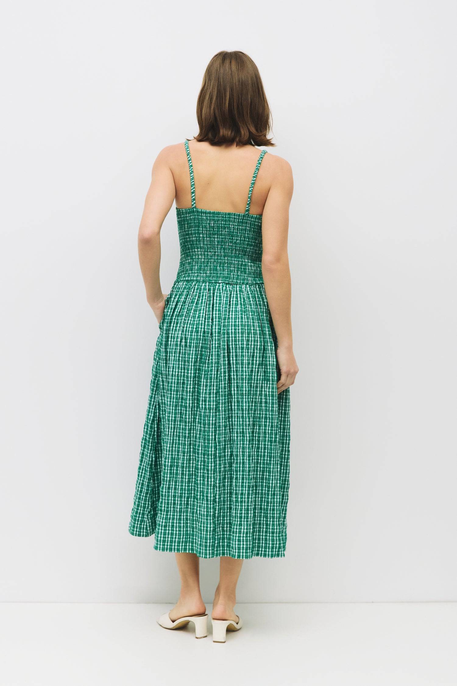 8988733636829, The Ebony Dress, Dress, All Row, brown,Casual,cf-color-chestnut,cf-color-natural,cf-color-white,cf-size-l,cf-size-m,cf-size-s,cf-vendor-all-row,Chestnut Brown,Comfort,Comfortable,dark brown,Feminine,Midi,Midi Dress,midi length,Minimal,natural,new,Pockets,Semi-Formal,side pockets,Sleeveless,Sleeveless Dress,Slight Flare,Smocked,Spring,versatile,white,Womens, Information The Ebony Dress is a midi-length, fit-and-flare style with a textured plaid print and elasticated shoulder straps for added c