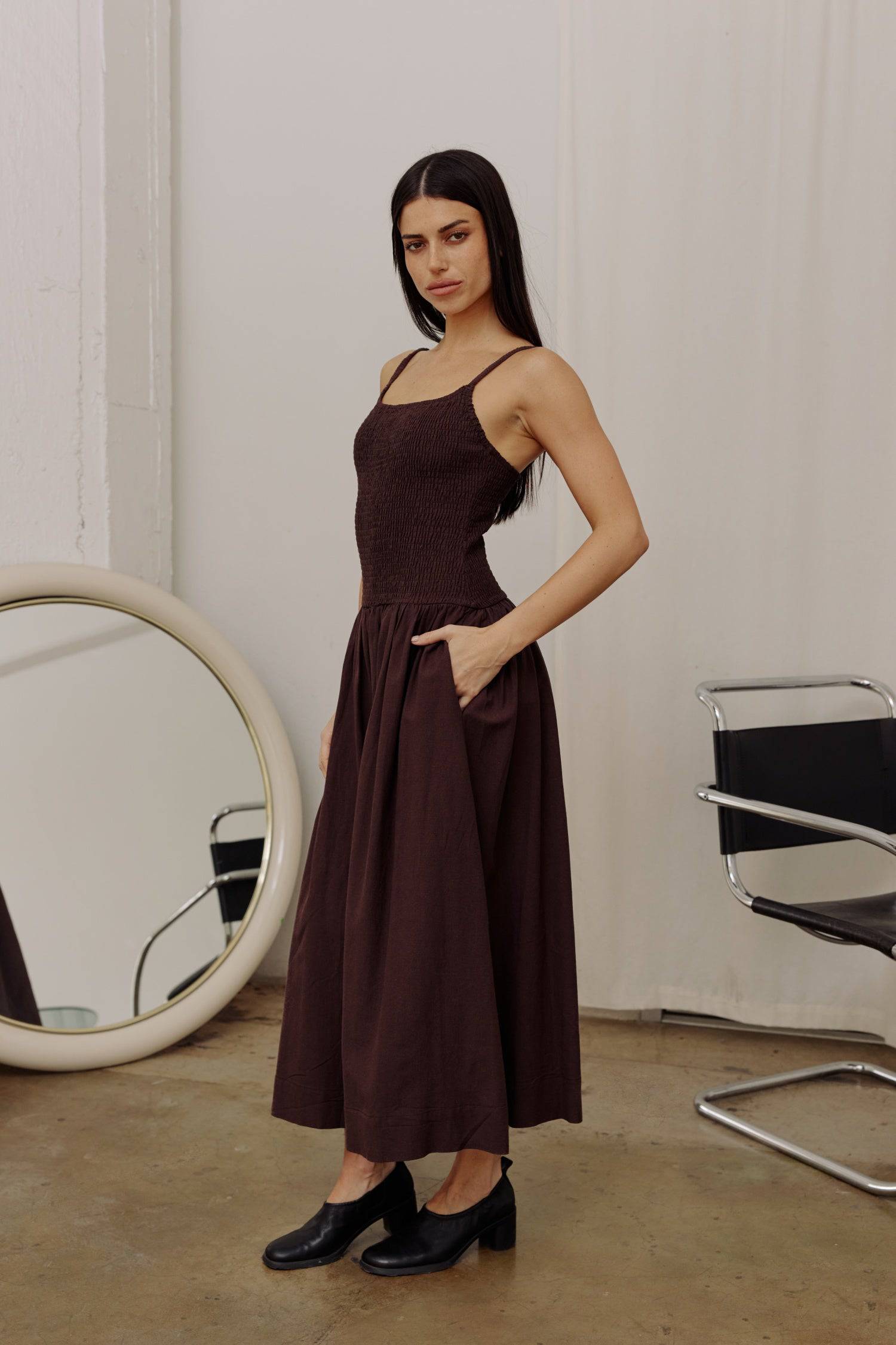 8346250805469, The Marcella Dress, Dress, All Row, brown,Casual,cf-color-chestnut,cf-color-natural,cf-color-white,cf-size-l,cf-size-m,cf-size-s,cf-vendor-all-row,Chestnut Brown,Comfort,Comfortable,dark brown,Feminine,Midi,Midi Dress,midi length,Minimal,minimalist,natural,new,Pockets,Semi-Formal,side pockets,Sleeveless,Sleeveless Dress,Slight Flare,Smocked,Spring,versatile,white,Womens, Information Meet The Marcella Dress, a stunning smocked dress that boasts a midi length with a fit and flare design that en