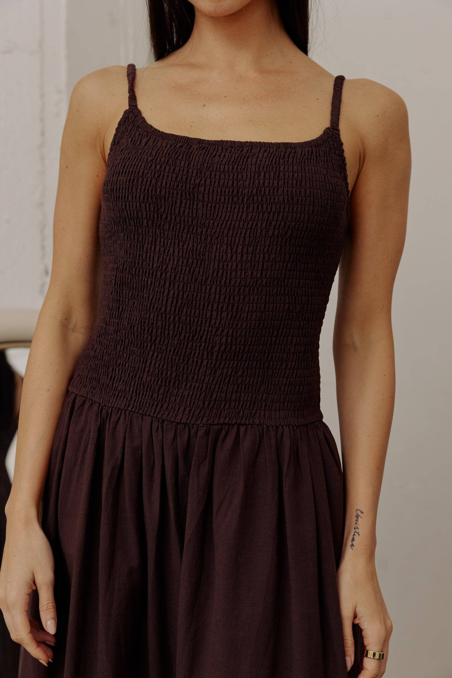 8346250805469, The Marcella Dress, Dress, All Row, brown,Casual,cf-color-chestnut,cf-color-natural,cf-color-white,cf-size-l,cf-size-m,cf-size-s,cf-vendor-all-row,Chestnut Brown,Comfort,Comfortable,dark brown,Feminine,Midi,Midi Dress,midi length,Minimal,minimalist,natural,new,Pockets,Semi-Formal,side pockets,Sleeveless,Sleeveless Dress,Slight Flare,Smocked,Spring,versatile,white,Womens, Information Meet The Marcella Dress, a stunning smocked dress that boasts a midi length with a fit and flare design that en