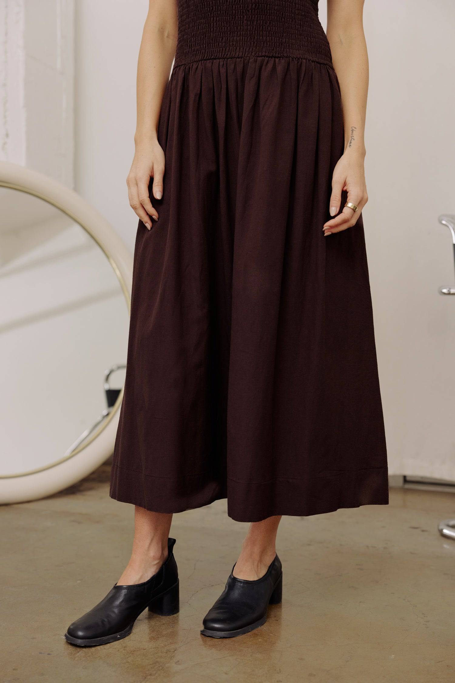 8346250805469, The Marcella Dress, Dress, All Row, brown,Casual,cf-color-chestnut,cf-color-natural,cf-color-white,cf-size-l,cf-size-m,cf-size-s,cf-vendor-all-row,Chestnut Brown,Comfort,Comfortable,dark brown,Feminine,Midi,Midi Dress,midi length,Minimal,minimalist,natural,new,Pockets,Semi-Formal,side pockets,Sleeveless,Sleeveless Dress,Slight Flare,Smocked,Spring,versatile,white,Womens, Information Meet The Marcella Dress, a stunning smocked dress that boasts a midi length with a fit and flare design that en