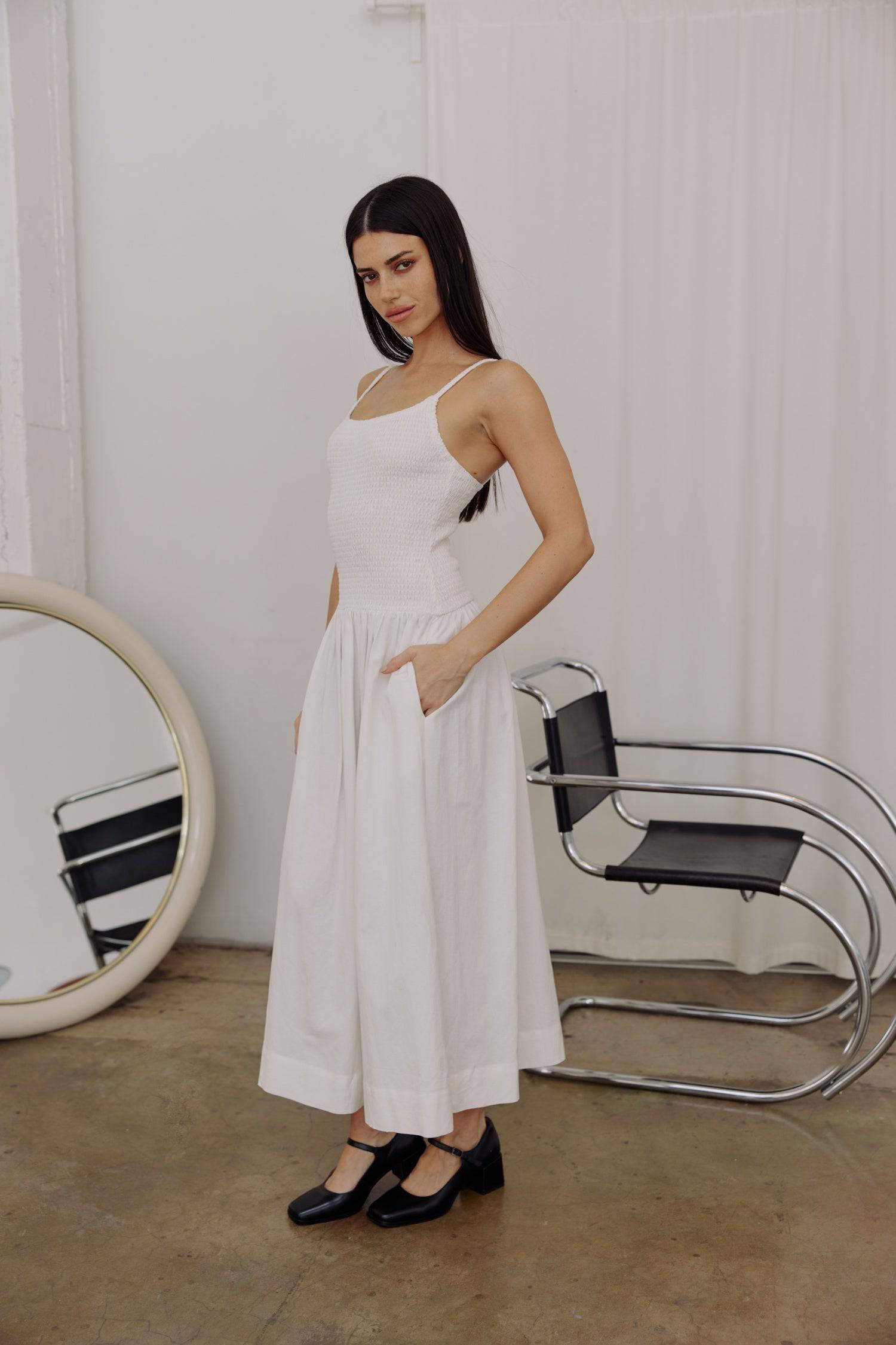 8346250805469, The Marcella Dress, Dress, All Row, brown,Casual,cf-color-chestnut,cf-color-natural,cf-color-white,cf-size-l,cf-size-m,cf-size-s,cf-vendor-all-row,Chestnut Brown,Comfort,Comfortable,dark brown,Feminine,Midi,Midi Dress,midi length,Minimal,minimalist,natural,new,Pockets,Semi-Formal,side pockets,Sleeveless,Sleeveless Dress,Slight Flare,Smocked,Spring,versatile,white,Womens, Information Meet The Marcella Dress, a stunning smocked dress that boasts a midi length with a fit and flare design that en