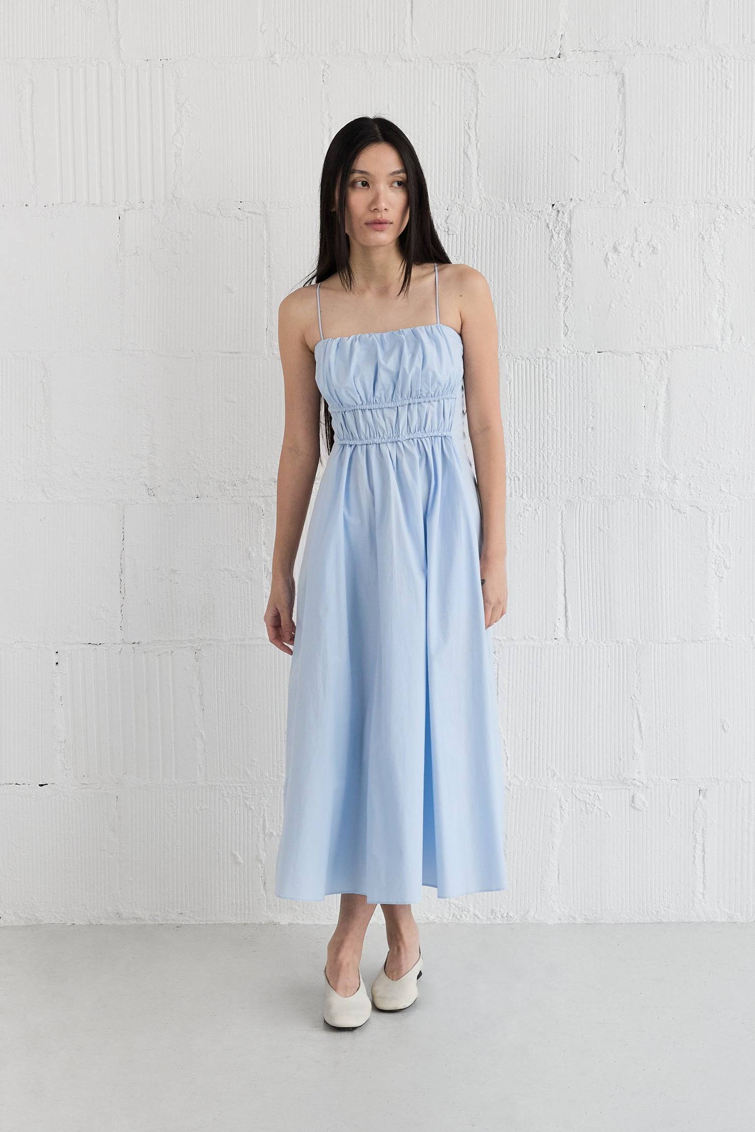 8346254213341, The Alice Dress, Dress, All Row, adjustable straps,Black,Casual,cf-color-black,cf-color-white,cf-size-l,cf-vendor-all-row,Comfort,Comfortable,Elastic Waist,Feminine,full skirt,Light Blue,Midi,Midi Dress,midi length,new,Pockets,Semi-Formal,Sleeveless,Sleeveless Dress,Spring,versatile,white,Womens, Information The Alice Dress is an enchanting gathered midi dress. It boasts an elasticated waistline detail and adjustable shoulder ties for a flattering fit. The full-length midi skirt design allows