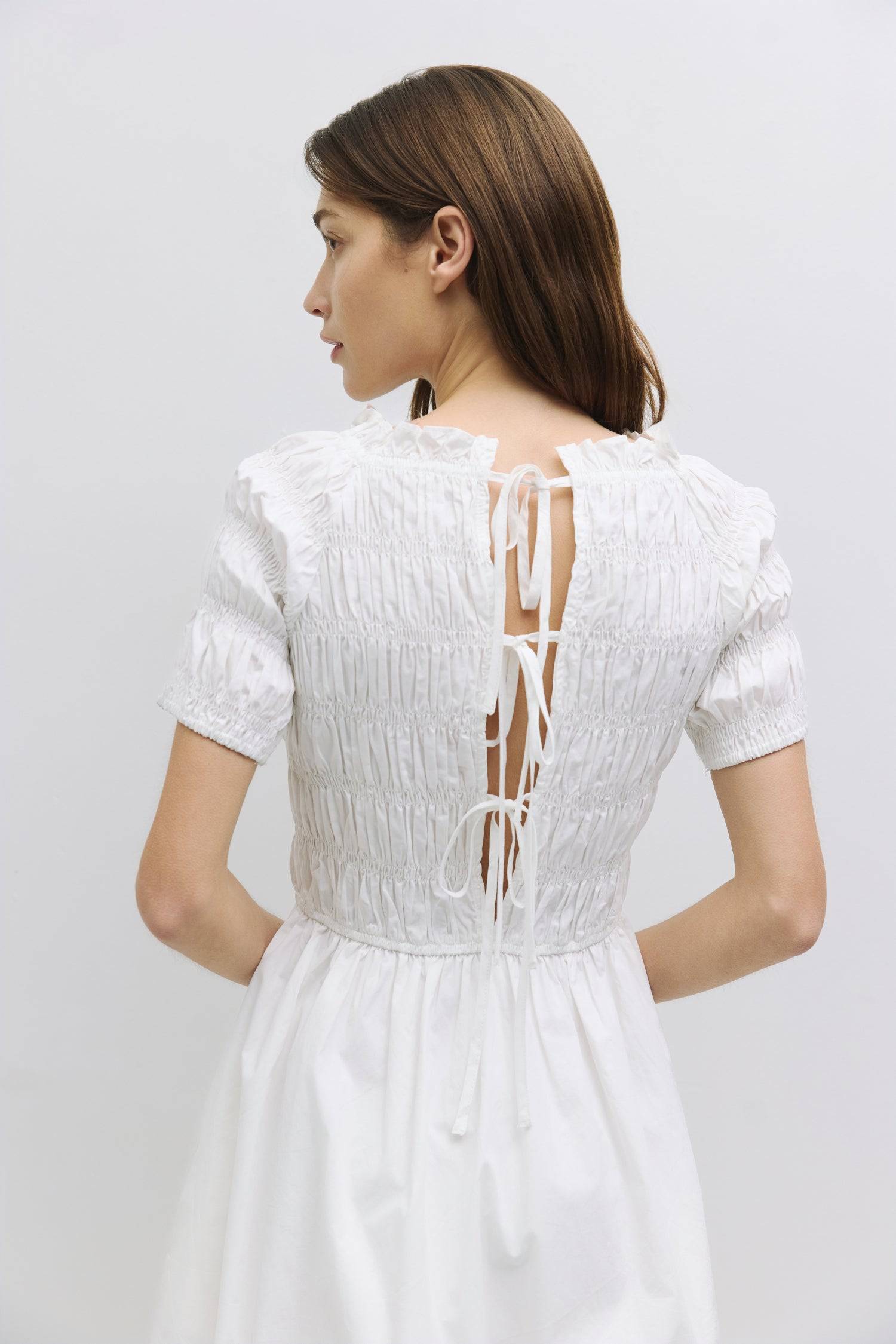9045699035357, The Roland Dress, Dress, All Row, adjustable ties,Black,Casual,cf-color-black,cf-color-cream,cf-size-l,cf-vendor-all-row,Comfort,Comfortable,Cream,Dress,dressy,Elastic Waist,Feminine,fit and flare,full skirt,Light Blue,Midi,Midi Dress,midi length,new,open back,Semi-Formal,Shirred Bodice,Spring,Summer,Transitional,versatile,Womens, Information The Roland Dress is a shirred midi dress featuring a fit-and-flare design with an open back and tie detail. The midi length and attached lining skirt en