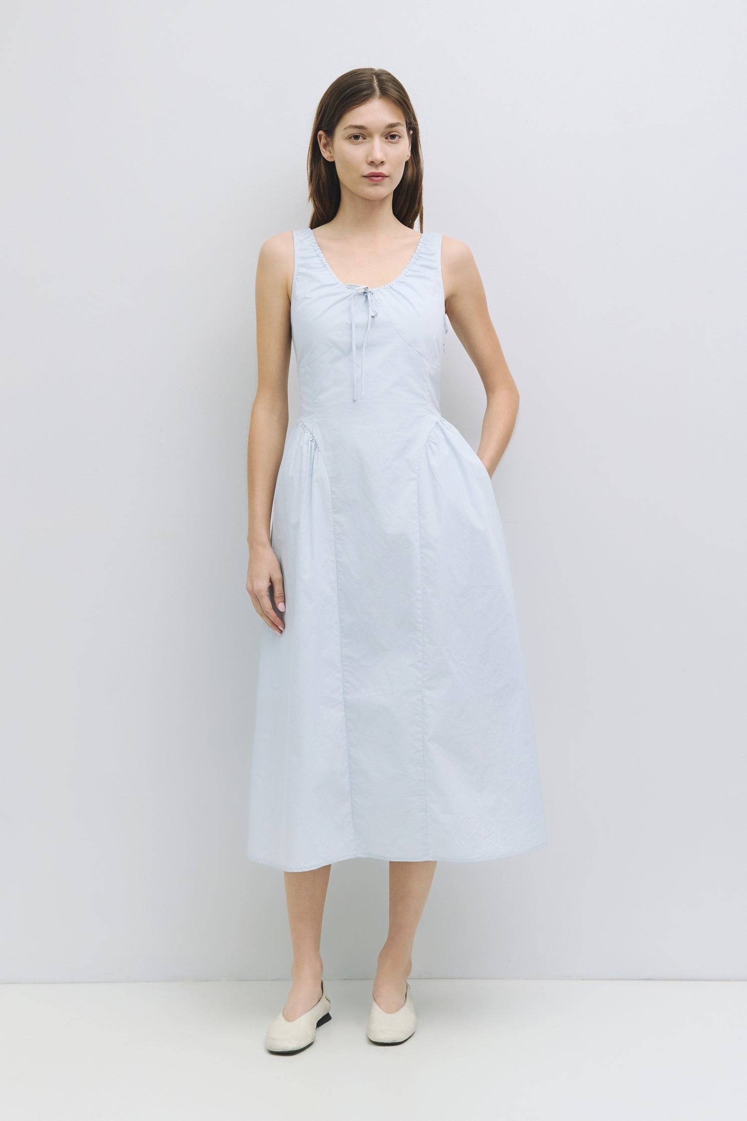 8911662874845, The Anika Dress, Dress, All Row, Casual,cf-color-white,cf-size-l,cf-size-m,cf-size-s,cf-vendor-mod-ref,Cinched Waist,Comfortable,Cotton,curve skirt,drawstring waist,Dress,dressy,final-sale,finalsale,Long Dress,maxi dress,Mid Length Dress,Midi,Midi Dress,midi length,new,sale,side pockets,Sleeveless,Spring,Summer,voluminous,womens, Information The Anika Dress is a comfortable sleeveless midi dress featuring a gathered neck design and front ties for a personalized fit. With shirring around the n