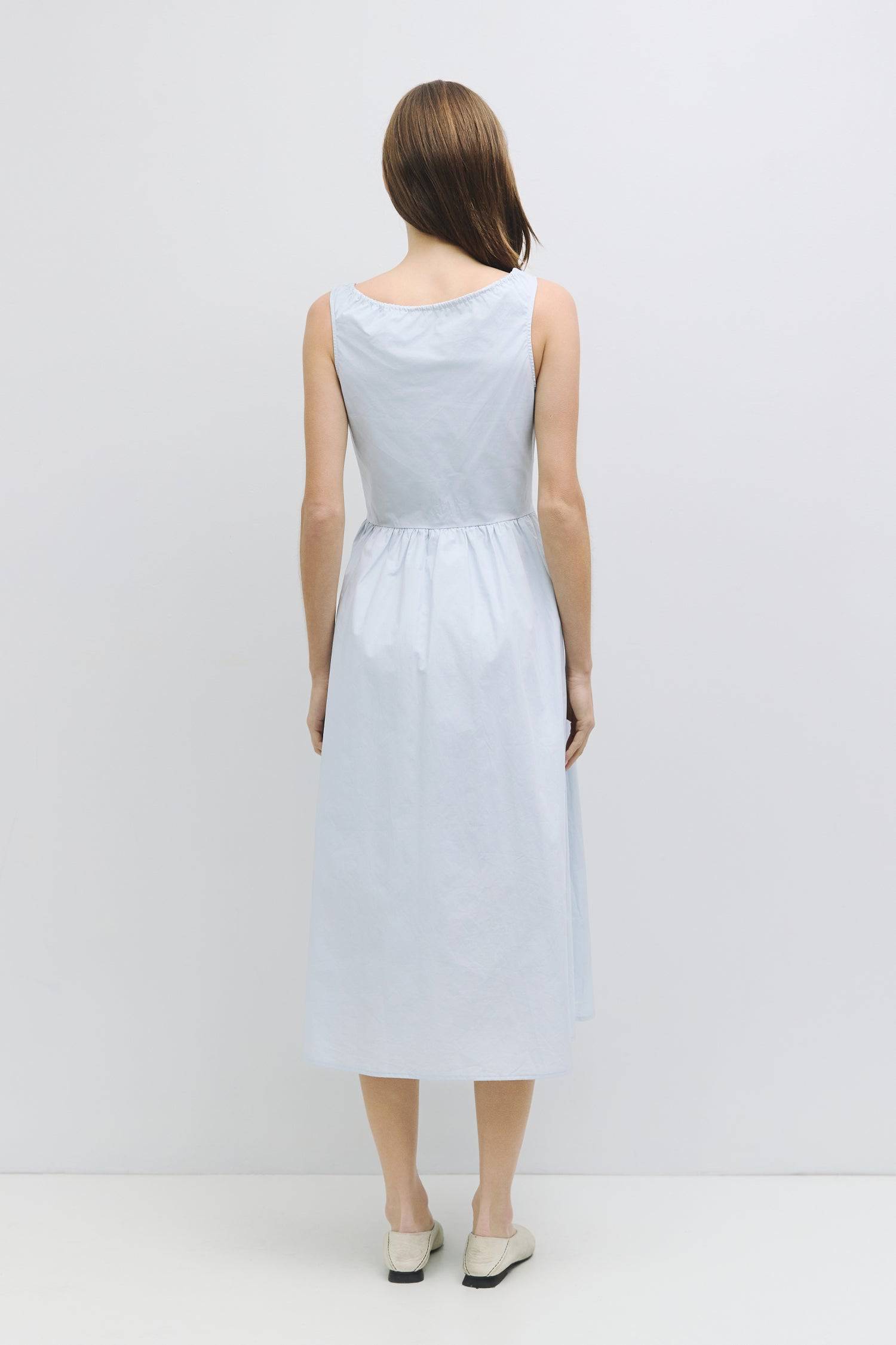 8911662874845, The Anika Dress, Dress, All Row, Casual,cf-color-white,cf-size-l,cf-size-m,cf-size-s,cf-vendor-mod-ref,Cinched Waist,Comfortable,Cotton,curve skirt,drawstring waist,Dress,dressy,final-sale,finalsale,Long Dress,maxi dress,Mid Length Dress,Midi,Midi Dress,midi length,new,sale,side pockets,Sleeveless,Spring,Summer,voluminous,womens, Information The Anika Dress is a comfortable sleeveless midi dress featuring a gathered neck design and front ties for a personalized fit. With shirring around the n