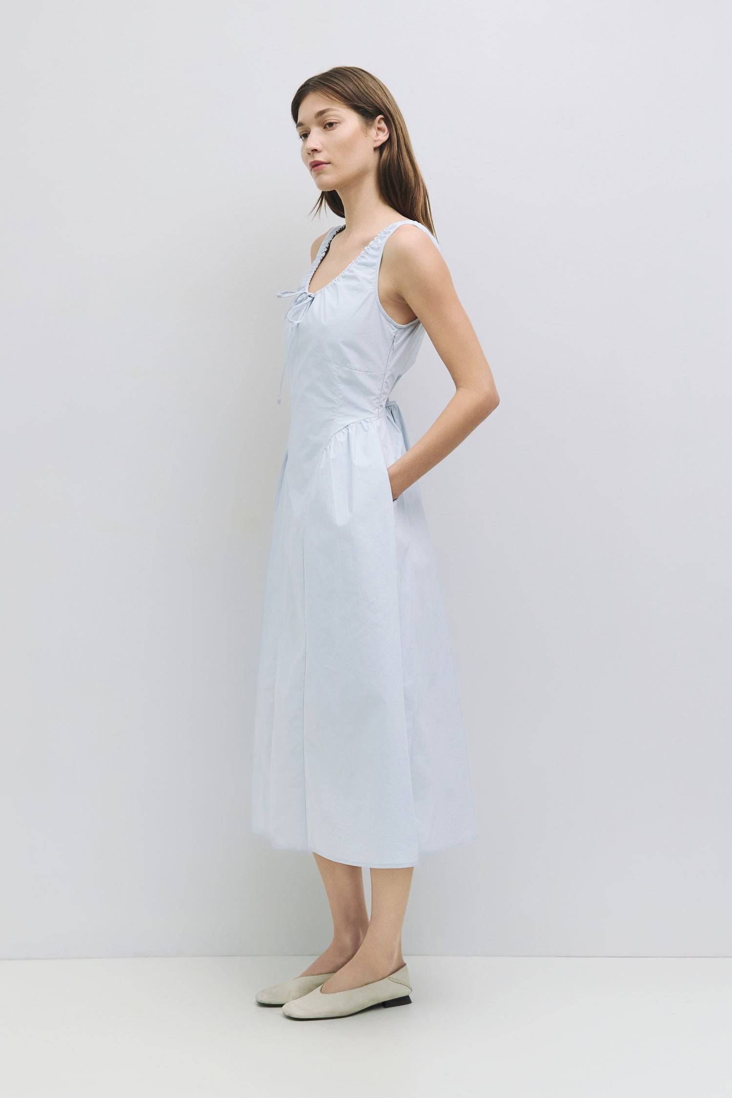 8911662874845, The Anika Dress, Dress, All Row, Casual,cf-color-white,cf-size-l,cf-size-m,cf-size-s,cf-vendor-mod-ref,Cinched Waist,Comfortable,Cotton,curve skirt,drawstring waist,Dress,dressy,final-sale,finalsale,Long Dress,maxi dress,Mid Length Dress,Midi,Midi Dress,midi length,new,sale,side pockets,Sleeveless,Spring,Summer,voluminous,womens, Information The Anika Dress is a comfortable sleeveless midi dress featuring a gathered neck design and front ties for a personalized fit. With shirring around the n