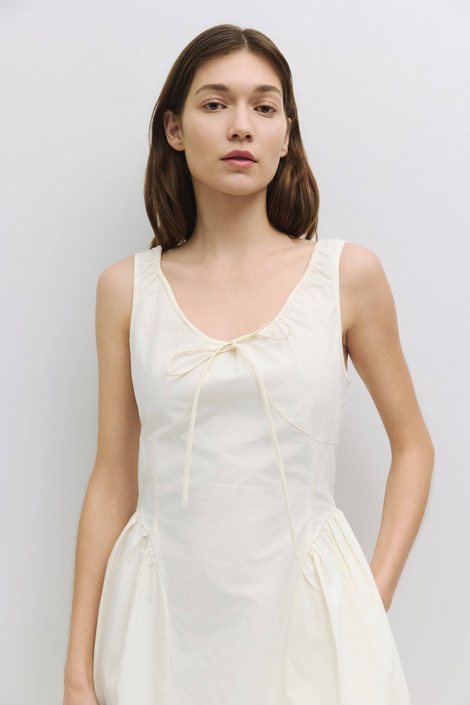 8911662874845, The Anika Dress, Dress, All Row, Casual,cf-color-white,cf-size-l,cf-size-m,cf-size-s,cf-vendor-mod-ref,Cinched Waist,Comfortable,Cotton,curve skirt,drawstring waist,Dress,dressy,final-sale,finalsale,Long Dress,maxi dress,Mid Length Dress,Midi,Midi Dress,midi length,new,sale,side pockets,Sleeveless,Spring,Summer,voluminous,womens, Information The Anika Dress is a comfortable sleeveless midi dress featuring a gathered neck design and front ties for a personalized fit. With shirring around the n