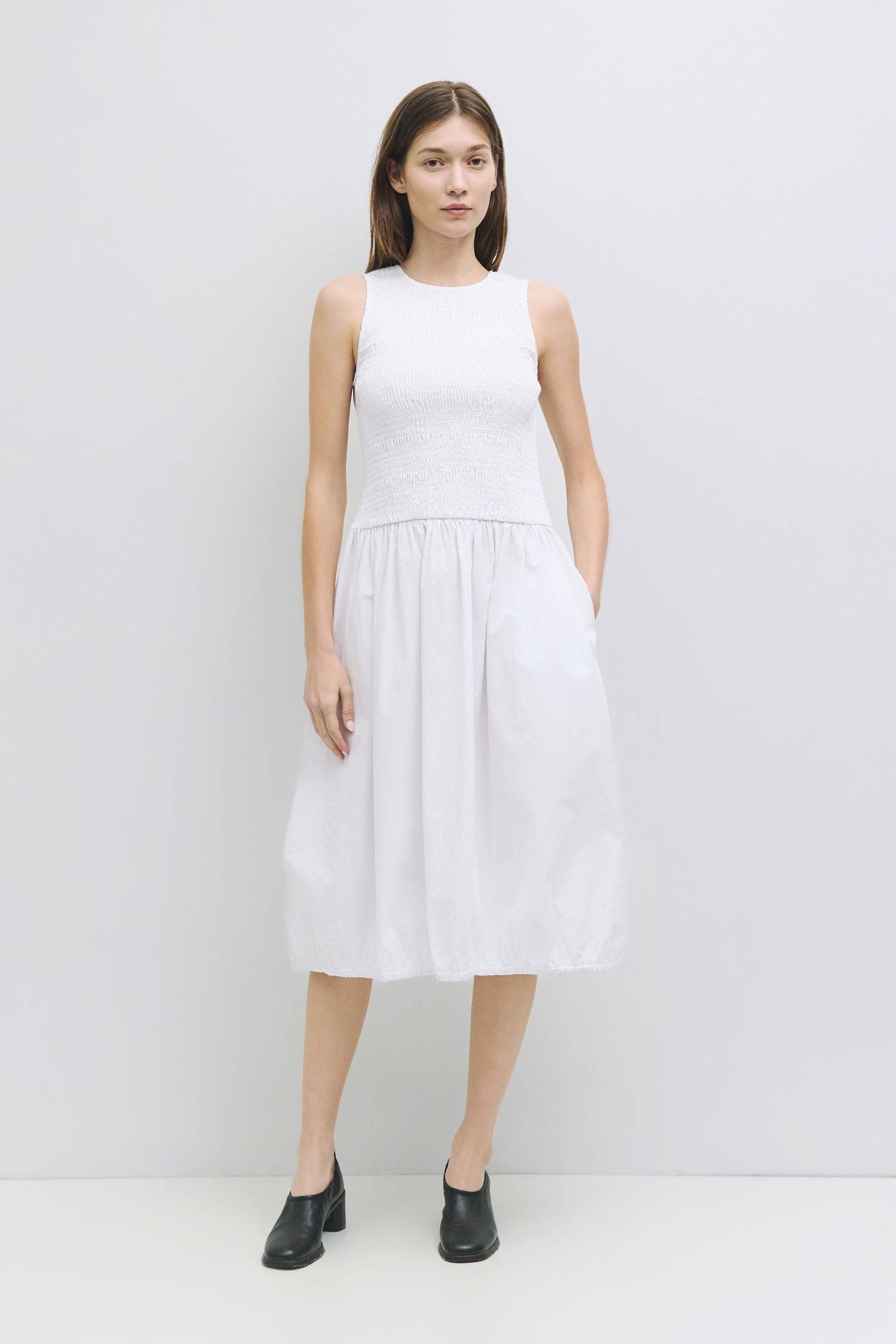 8982638821597, The Isla Dress, Dress, All Row, adjustable straps,Casual,cf-color-black,cf-color-white,cf-size-l,cf-vendor-all-row,Comfort,Comfortable,Elastic Waist,Feminine,full skirt,Light Blue,Midi,Midi Dress,midi length,new,Pockets,Semi-Formal,Sleeveless,Sleeveless Dress,Spring,versatile,white,Womens, Information The Isla Dress is the perfect spring and summer midi dress designed with a smocked top, crew neckline, elastic shirred hem, and back keyhole button closure. Details 100% Cotton Smocked Top Crew