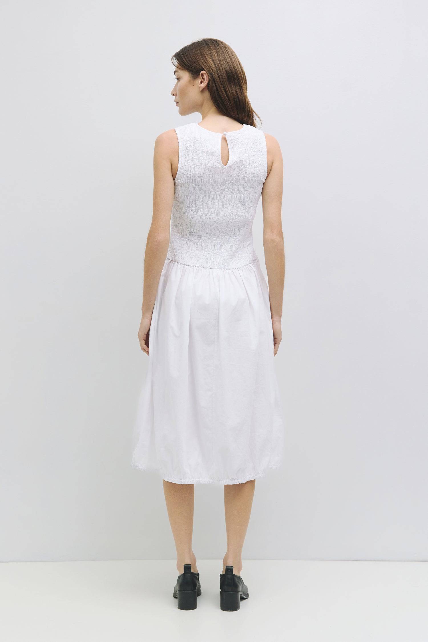 8982638821597, The Isla Dress, Dress, All Row, adjustable straps,Casual,cf-color-black,cf-color-white,cf-size-l,cf-vendor-all-row,Comfort,Comfortable,Elastic Waist,Feminine,full skirt,Light Blue,Midi,Midi Dress,midi length,new,Pockets,Semi-Formal,Sleeveless,Sleeveless Dress,Spring,versatile,white,Womens, Information The Isla Dress is the perfect spring and summer midi dress designed with a smocked top, crew neckline, elastic shirred hem, and back keyhole button closure. Details 100% Cotton Smocked Top Crew