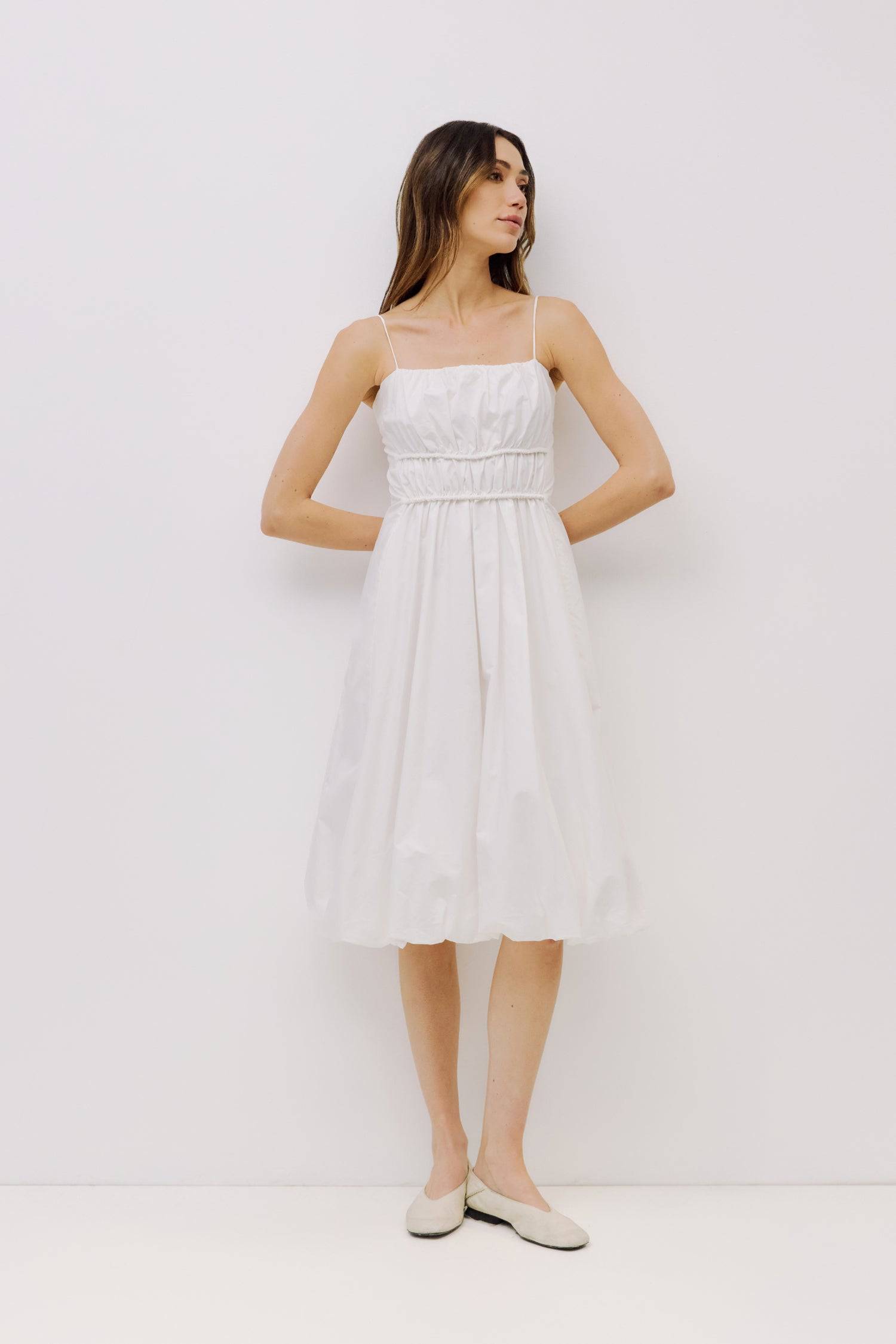 9023157993693, The Ella Dress, Dress, All Row, adjustable straps,bubble,bubble skirt,Casual,cf-color-white,cf-size-l,cf-vendor-all-row,Comfort,Comfortable,Dress,dressy,Elastic Waist,Feminine,full skirt,Light Blue,Midi,Midi Dress,midi length,Navy,new,Semi-Formal,Sleeveless,Sleeveless Dress,Spring,Summer,Transitional,versatile,white,Womens, Information The Ella Dress is a bubble skirt dress crafted from lightweight fabric, offering a relaxed yet flattering fit. With adjustable spaghetti straps and hidden fron