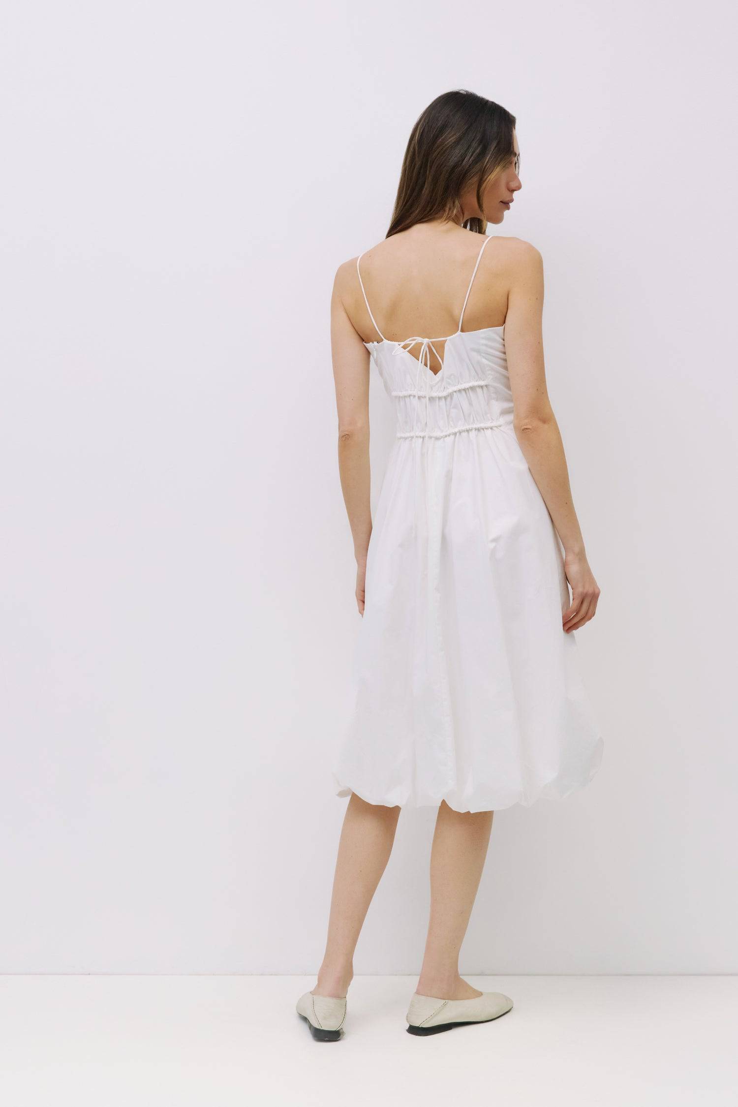 9023157993693, The Ella Dress, Dress, All Row, adjustable straps,bubble,bubble skirt,Casual,cf-color-white,cf-size-l,cf-vendor-all-row,Comfort,Comfortable,Dress,dressy,Elastic Waist,Feminine,full skirt,Light Blue,Midi,Midi Dress,midi length,Navy,new,Semi-Formal,Sleeveless,Sleeveless Dress,Spring,Summer,Transitional,versatile,white,Womens, Information The Ella Dress is a bubble skirt dress crafted from lightweight fabric, offering a relaxed yet flattering fit. With adjustable spaghetti straps and hidden fron