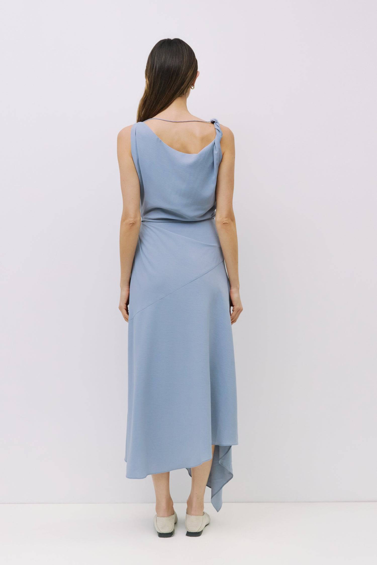 9023137677533, The Renee Dress, Dress, Mod Ref, asymmetrical,asymmetrical skirt,Black,Blue,cf-color-black,cf-size-l,cf-vendor-all-row,collared,Comfort,Comfortable,cowl neck,drape,Draped,Feminine,fit and flare,fitted bodice,formal,full skirt,Light Blue,Midi,Midi Dress,midi length,new,Red,Relaxed Fit,semi formal,Sleeveless,Sleeveless Dress,Spring,versatile,Womens, Information The Renee Dress is a sleeveless maxi dress with an asymmetrical cowl neckline and a twisted strap detail on the right shoulder. Fitted
