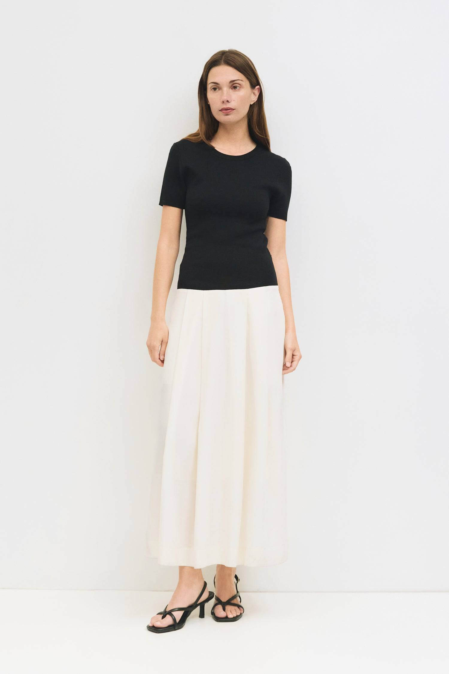 9065342173405, The Geena Dress, Dress, Mod Ref, Black,Casual,cf-color-black,cf-color-khaki,cf-color-white,cf-size-l,cf-size-m,cf-size-s,cf-vendor-mod-ref,Cinched Waist,Color Block,Comfortable,corset,Dress,dressy,Form Fitting,Long Dress,maxi dress,Mid Length Dress,Midi,Midi Dress,midi length,new,Pleated,pleated skirt,pleating,Pleats,Pocket,Pockets,Relaxed Fit,side pockets,Spring,square,Summer,white,womens, Information The Geena Dress features a crew neck and short sleeves with a form-fitting knit top that fl