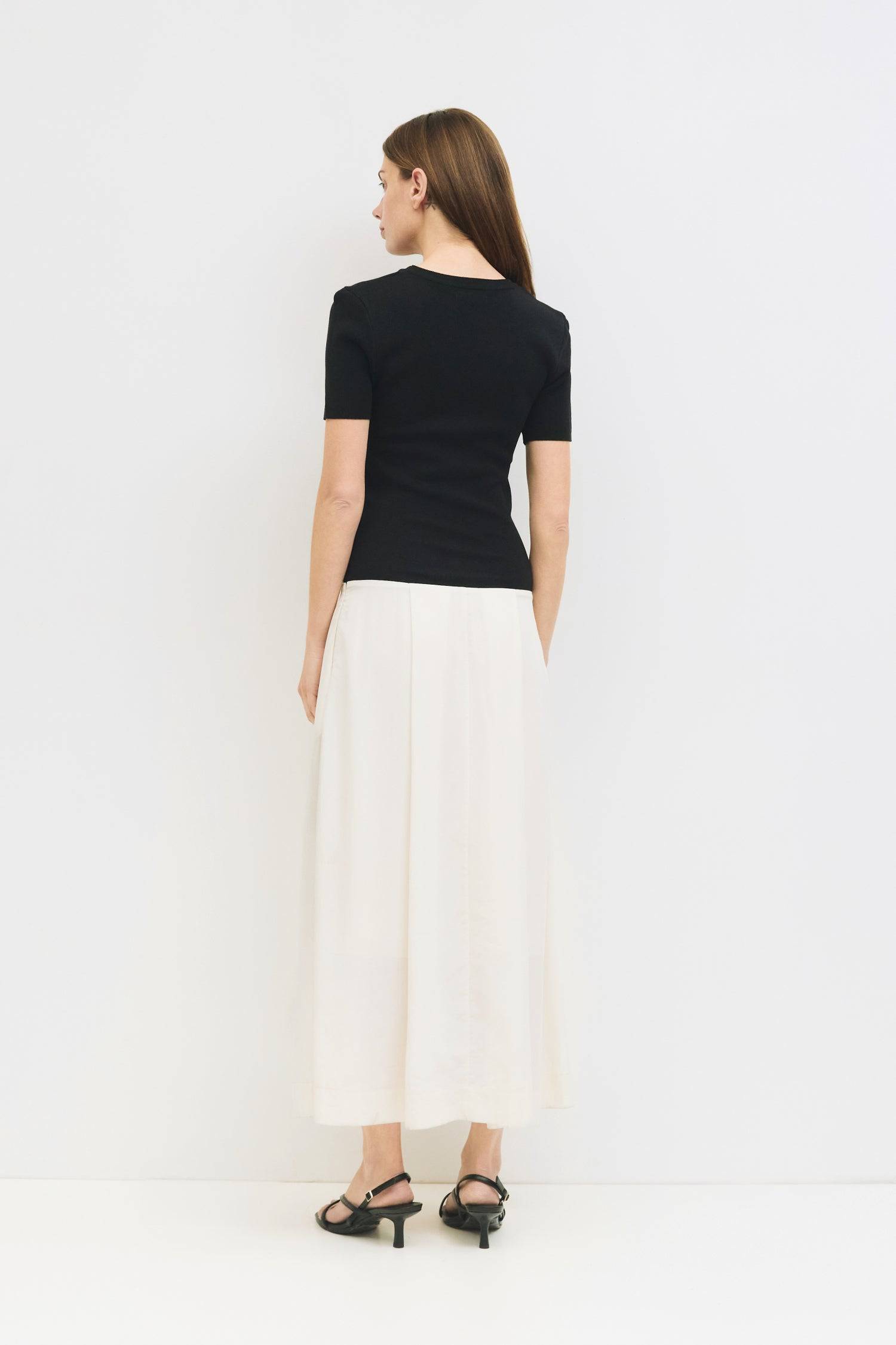 9065342173405, The Geena Dress, Dress, Mod Ref, Black,Casual,cf-color-black,cf-color-khaki,cf-color-white,cf-size-l,cf-size-m,cf-size-s,cf-vendor-mod-ref,Cinched Waist,Color Block,Comfortable,corset,Dress,dressy,Form Fitting,Long Dress,maxi dress,Mid Length Dress,Midi,Midi Dress,midi length,new,Pleated,pleated skirt,pleating,Pleats,Pocket,Pockets,Relaxed Fit,side pockets,Spring,square,Summer,white,womens, Information The Geena Dress features a crew neck and short sleeves with a form-fitting knit top that fl