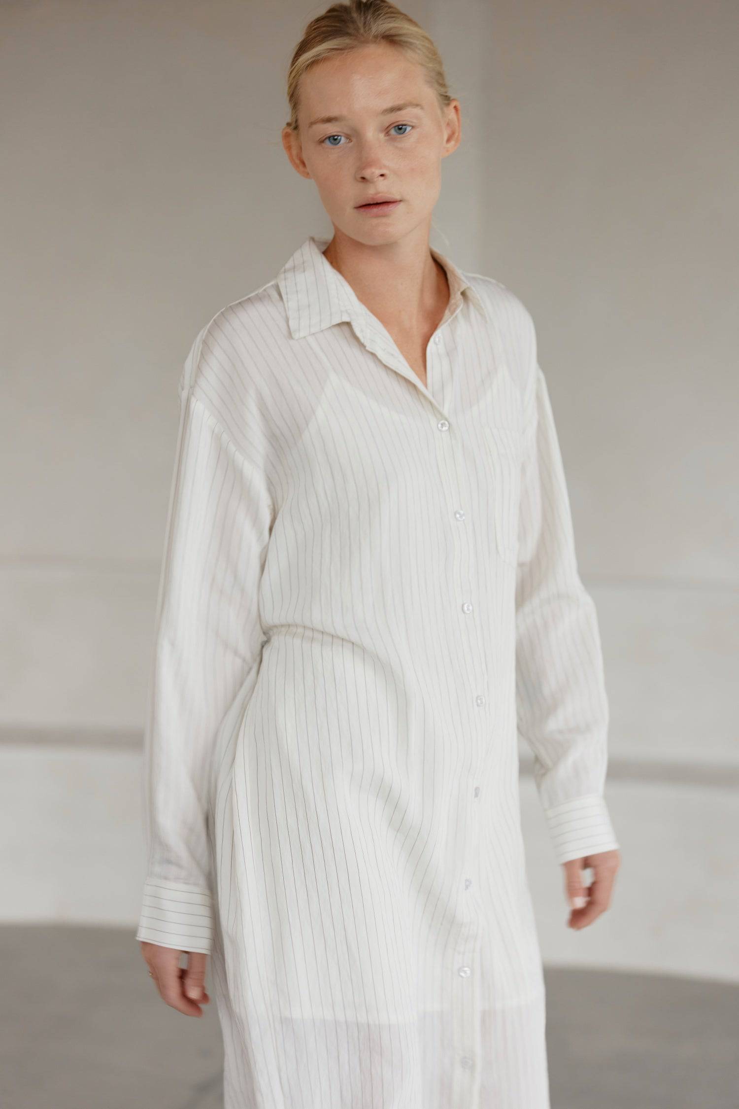 8364403556573, The Jill Dress, Dress, Mod Ref, Button down,button down dress,cf-color-ivory,cf-color-navy,cf-size-l,cf-size-m,cf-size-s,cf-vendor-mod-ref,Comfort,Comfortable,Comfy,Dress,everyday,final-sale,finalsale,ivory,Lining,Mid Length Dress,Midi,Midi Dress,Navy,new,Pinstriped,Pinstripes,Relaxed Fit,sale,Semi-Sheer,Sheer,Short Sleeve Dress,Summer,white,womens, Information Introducing The Jill Dress, a pinstripe design button-down midi dress. Crafted from a breathable semi-transparent fabric, it comes wi