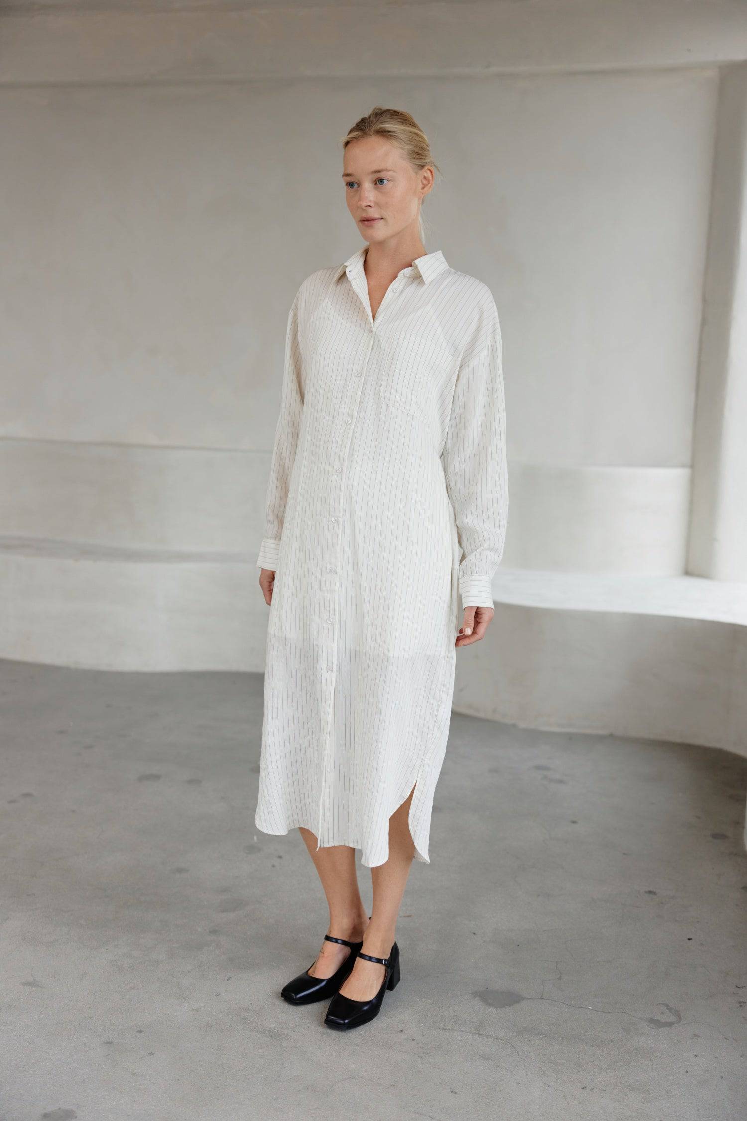 8364403556573, The Jill Dress, Dress, Mod Ref, Button down,button down dress,cf-color-ivory,cf-color-navy,cf-size-l,cf-size-m,cf-size-s,cf-vendor-mod-ref,Comfort,Comfortable,Comfy,Dress,everyday,final-sale,finalsale,ivory,Lining,Mid Length Dress,Midi,Midi Dress,Navy,new,Pinstriped,Pinstripes,Relaxed Fit,sale,Semi-Sheer,Sheer,Short Sleeve Dress,Summer,white,womens, Information Introducing The Jill Dress, a pinstripe design button-down midi dress. Crafted from a breathable semi-transparent fabric, it comes wi