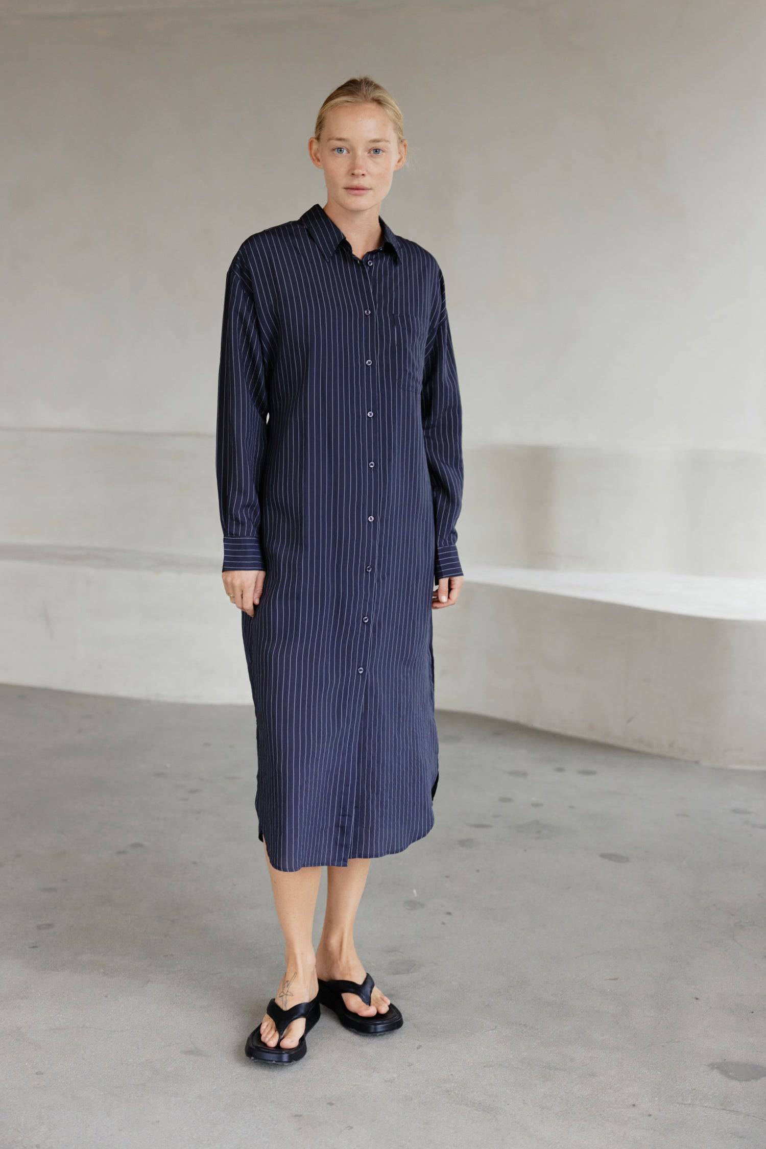 8364403556573, The Jill Dress, Dress, Mod Ref, Button down,button down dress,cf-color-ivory,cf-color-navy,cf-size-l,cf-size-m,cf-size-s,cf-vendor-mod-ref,Comfort,Comfortable,Comfy,Dress,everyday,final-sale,finalsale,ivory,Lining,Mid Length Dress,Midi,Midi Dress,Navy,new,Pinstriped,Pinstripes,Relaxed Fit,sale,Semi-Sheer,Sheer,Short Sleeve Dress,Summer,white,womens, Information Introducing The Jill Dress, a pinstripe design button-down midi dress. Crafted from a breathable semi-transparent fabric, it comes wi