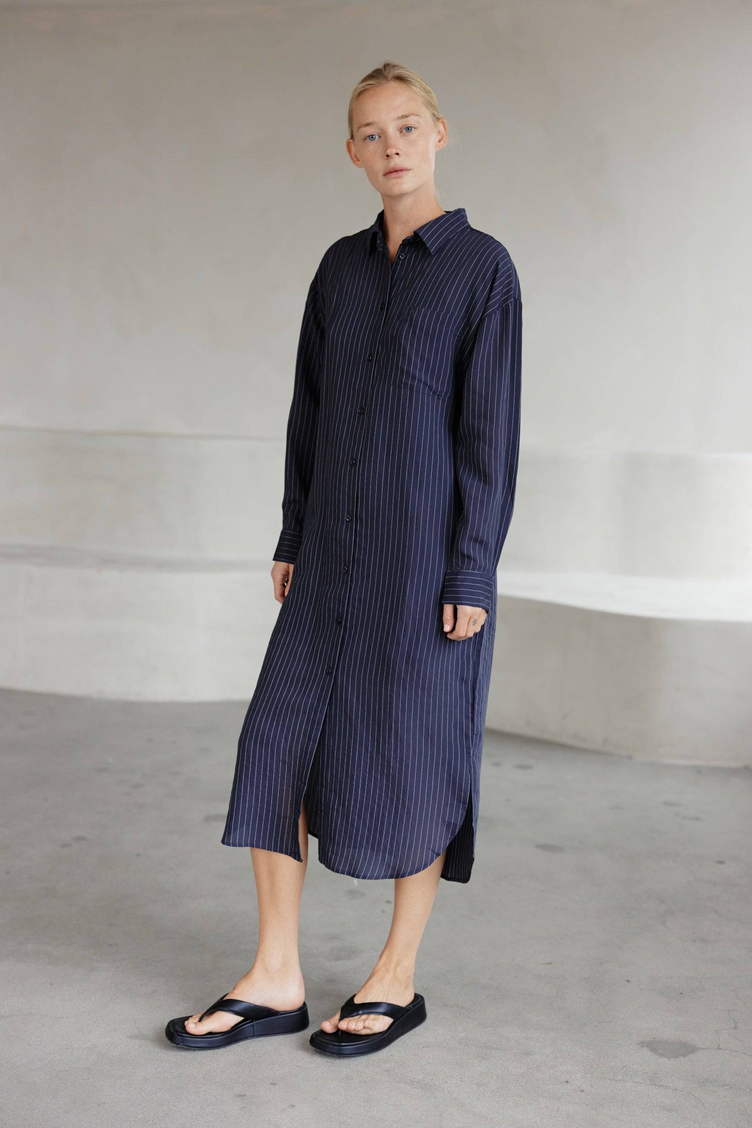 8364403556573, The Jill Dress, Dress, Mod Ref, Button down,button down dress,cf-color-ivory,cf-color-navy,cf-size-l,cf-size-m,cf-size-s,cf-vendor-mod-ref,Comfort,Comfortable,Comfy,Dress,everyday,final-sale,finalsale,ivory,Lining,Mid Length Dress,Midi,Midi Dress,Navy,new,Pinstriped,Pinstripes,Relaxed Fit,sale,Semi-Sheer,Sheer,Short Sleeve Dress,Summer,white,womens, Information Introducing The Jill Dress, a pinstripe design button-down midi dress. Crafted from a breathable semi-transparent fabric, it comes wi