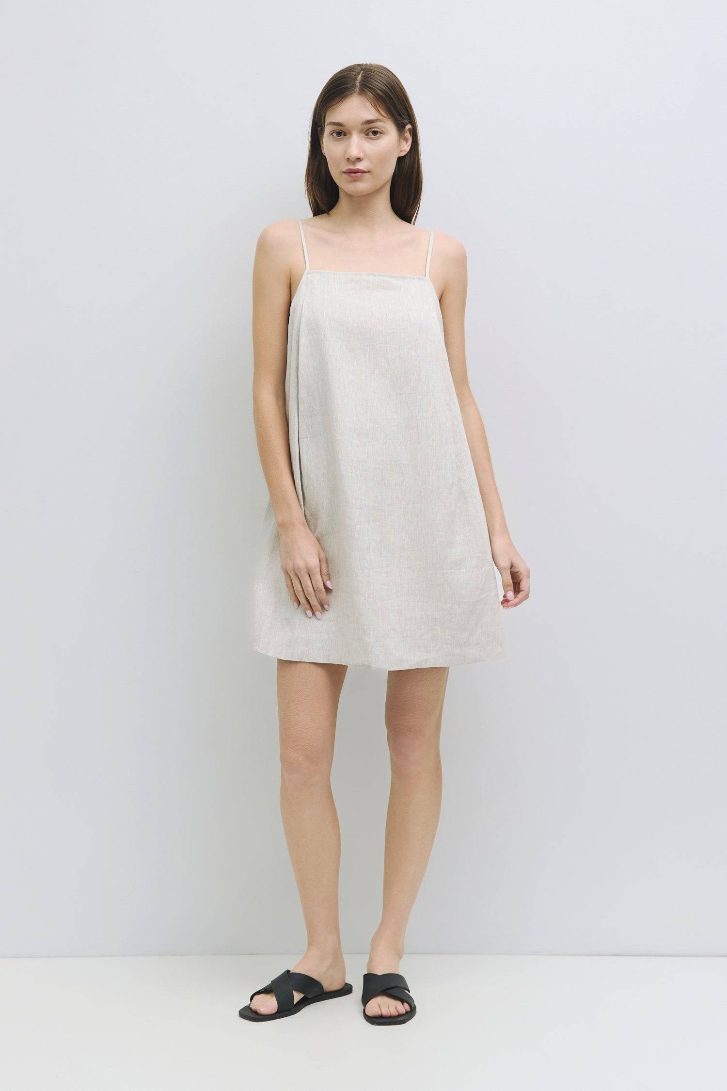 8931227402461, The Andie Dress, Dress, Mod Ref, a line,adjustable straps,babydoll,Casual,cf-size-l,cf-size-m,cf-size-s,Comfortable,drape,everyday,Feminine,lined,Linen,linen-blend,Mini Dress,new,Semi-Formal,Slip,Spaghetti straps,Square Neckline,Squared Neckline,womens, Information The Andie Dress is a mini dress made from 100% linen, featuring adjustable spaghetti straps and a square neckline. With its loose fit and back zipper closure, it's fully lined for added comfort and style. Details Self: 100% Linen L