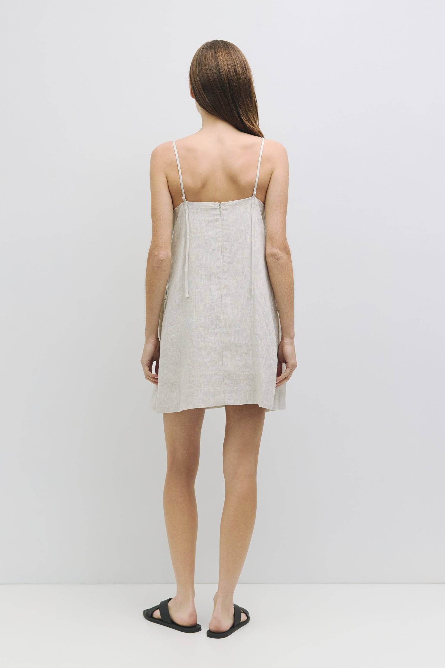 8931227402461, The Andie Dress, Dress, Mod Ref, a line,adjustable straps,babydoll,Casual,cf-size-l,cf-size-m,cf-size-s,Comfortable,drape,everyday,Feminine,lined,Linen,linen-blend,Mini Dress,new,Semi-Formal,Slip,Spaghetti straps,Square Neckline,Squared Neckline,womens, Information The Andie Dress is a mini dress made from 100% linen, featuring adjustable spaghetti straps and a square neckline. With its loose fit and back zipper closure, it's fully lined for added comfort and style. Details Self: 100% Linen L