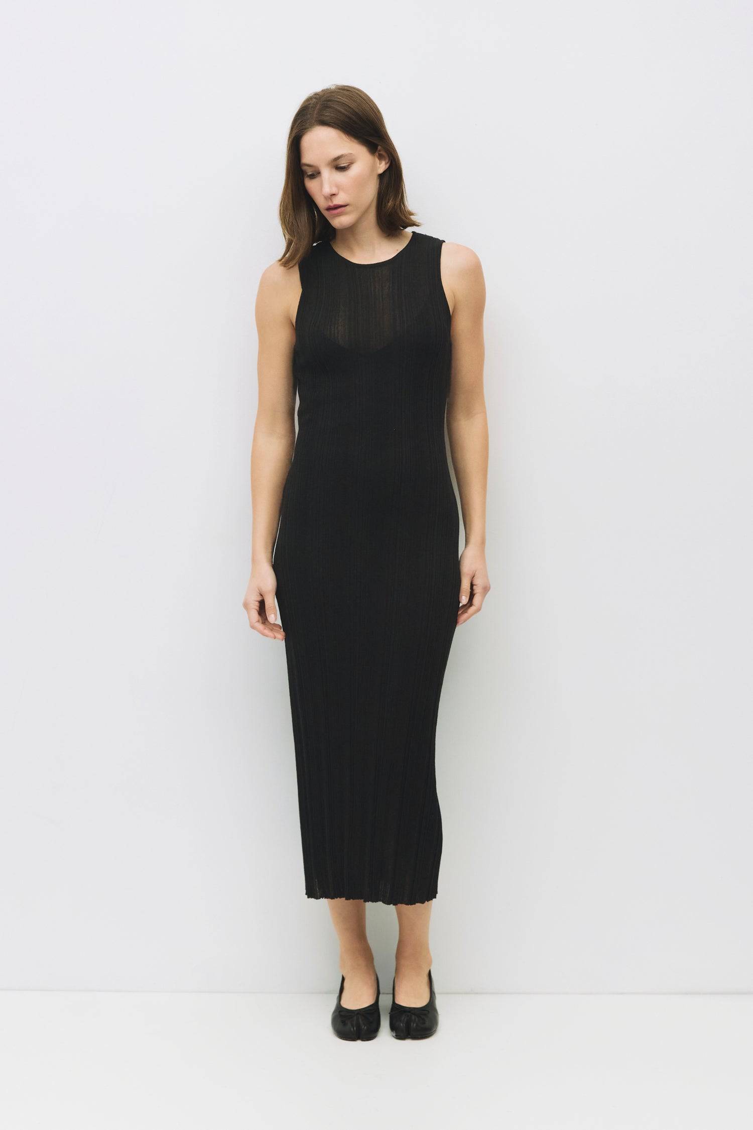 8954054705373, The Trinity Dress, Dress, Mod Ref, Black,Casual,cf-color-black,cf-color-cream,cf-color-khaki,cf-color-white,cf-size-l,cf-size-m,cf-size-s,cf-vendor-mod-ref,Cinched Waist,Color Block,Comfortable,corset,Cream,Dress,dressy,Form Fitting,Long Dress,maxi dress,Mid Length Dress,Midi,Midi Dress,midi length,new,Pleated,pleating,Pleats,Pocket,Relaxed Fit,side pockets,Spring,square,Summer,womens, Information The Trinity Dress fuses sheer ribbed knitting with a round neckline and sleeveless design for a