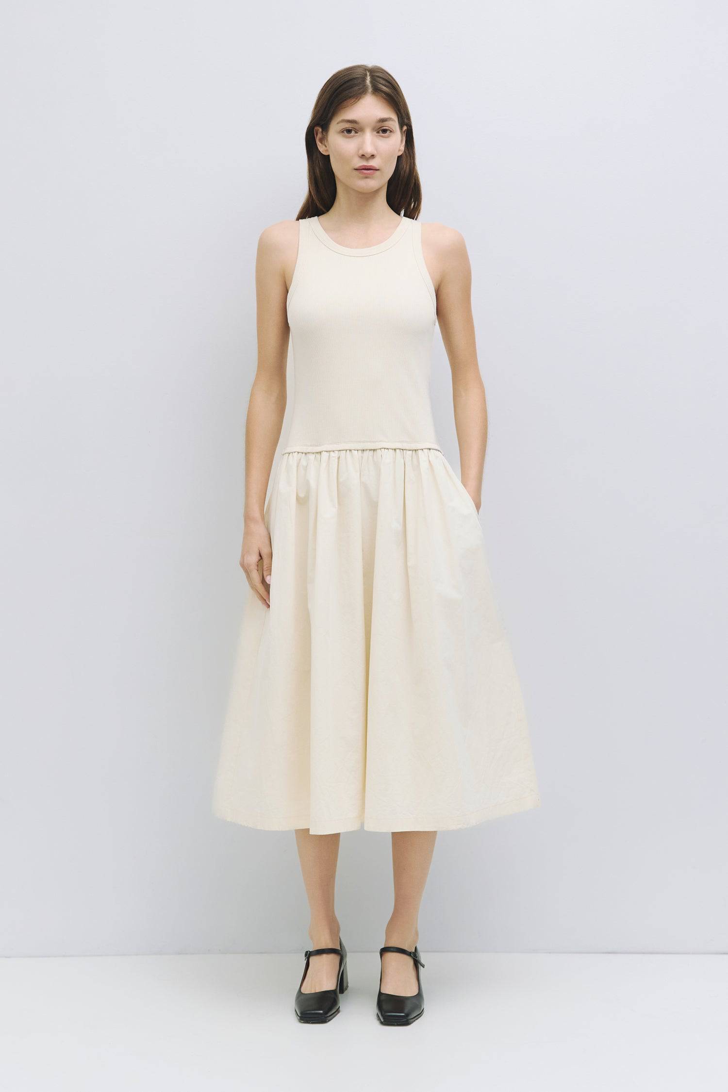 8919177265373, The Claire Dress, Dress, Mod Ref, Casual,cf-color-black,cf-color-cream,cf-color-white,cf-size-l,cf-size-m,cf-size-s,cf-vendor-mod-ref,Cinched Waist,Comfortable,Cotton,Cream,curve skirt,drawstring waist,Dress,dressy,Everyday,Long Dress,maxi dress,Mid Length Dress,Midi,Midi Dress,midi length,new,side pockets,Sleeveless,Spring,Summer,voluminous,womens, Information The Claire Dress offers a chic 2-in-1 design with a ribbed knit tank top, featuring binding details at the armholes and neckline for