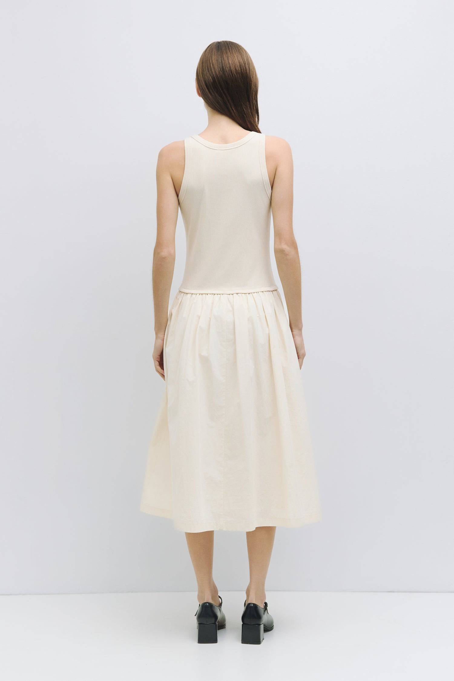 8919177265373, The Claire Dress, Dress, Mod Ref, Casual,cf-color-black,cf-color-cream,cf-color-white,cf-size-l,cf-size-m,cf-size-s,cf-vendor-mod-ref,Cinched Waist,Comfortable,Cotton,Cream,curve skirt,drawstring waist,Dress,dressy,Everyday,Long Dress,maxi dress,Mid Length Dress,Midi,Midi Dress,midi length,new,side pockets,Sleeveless,Spring,Summer,voluminous,womens, Information The Claire Dress offers a chic 2-in-1 design with a ribbed knit tank top, featuring binding details at the armholes and neckline for