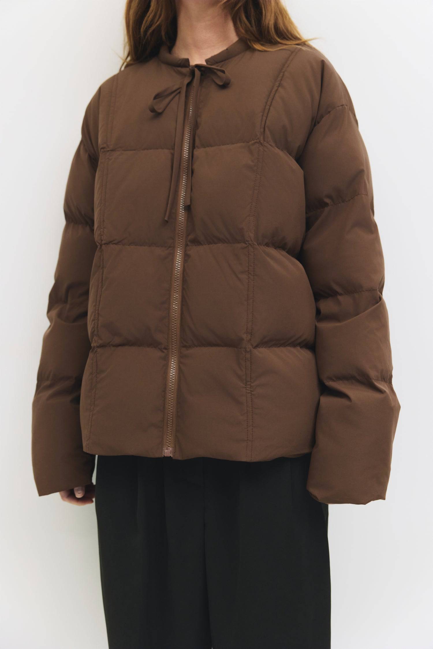 9084496347357, The Mila Jacket, Outerwear, All Row, All Row,allrow,Back Detail,Black,Casual,cf-color-black,cf-size-l,cf-size-m,cf-vendor-all-row,Coat,Comfortable,Cropped,cropped hemline,Detail,Everyday,Faux Leather,genderless,Jacket,Leather,leather jacket,Minimal,minimalist,new,Outerwear,Pleather,Polyester,Semi-Formal,Spring,statement,statement piece,Transitional,vegan leather,versatile,Womens,womens top, Information The Mila Jacket is a fully lined puffer style with quilted padding for added warmth. Design